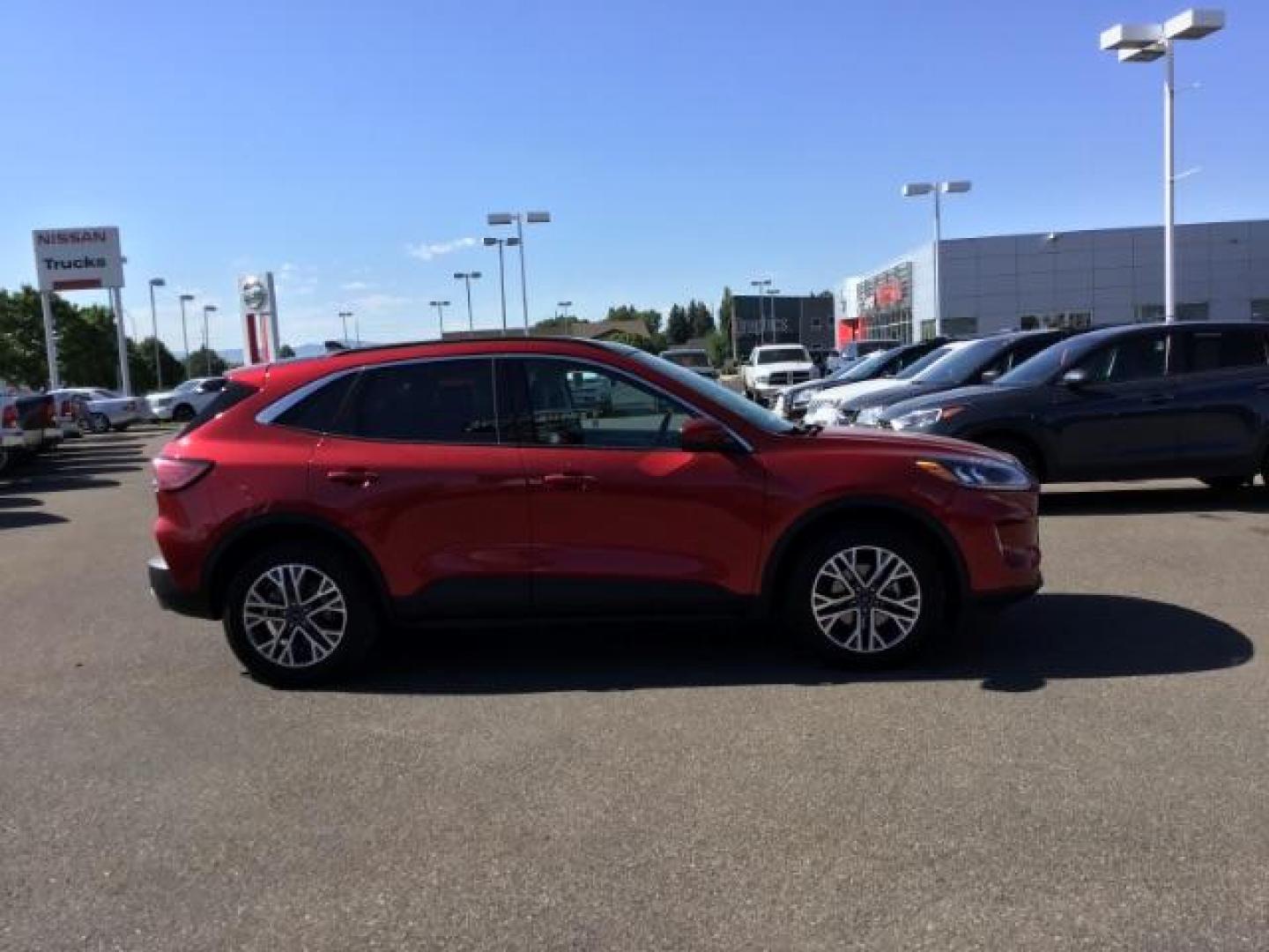 2021 Rapid Red Metallic Tinted Clearcoat /Ebony Ford Escape SEL AWD (1FMCU9H62MU) with an 1.5L L3 engine, 8-Speed Automatic transmission, located at 1235 N Woodruff Ave., Idaho Falls, 83401, (208) 523-1053, 43.507172, -112.000488 - 2021 Ford Escape SEL package with the 1.5L EcoBoost engine, heated seats, remote start, dual moonroof, and so much more! At Timberline Auto it is always easy to find a great deal on your next vehicle! Our experienced sales staff can help find the right vehicle that will fit your needs. Our knowled - Photo#6