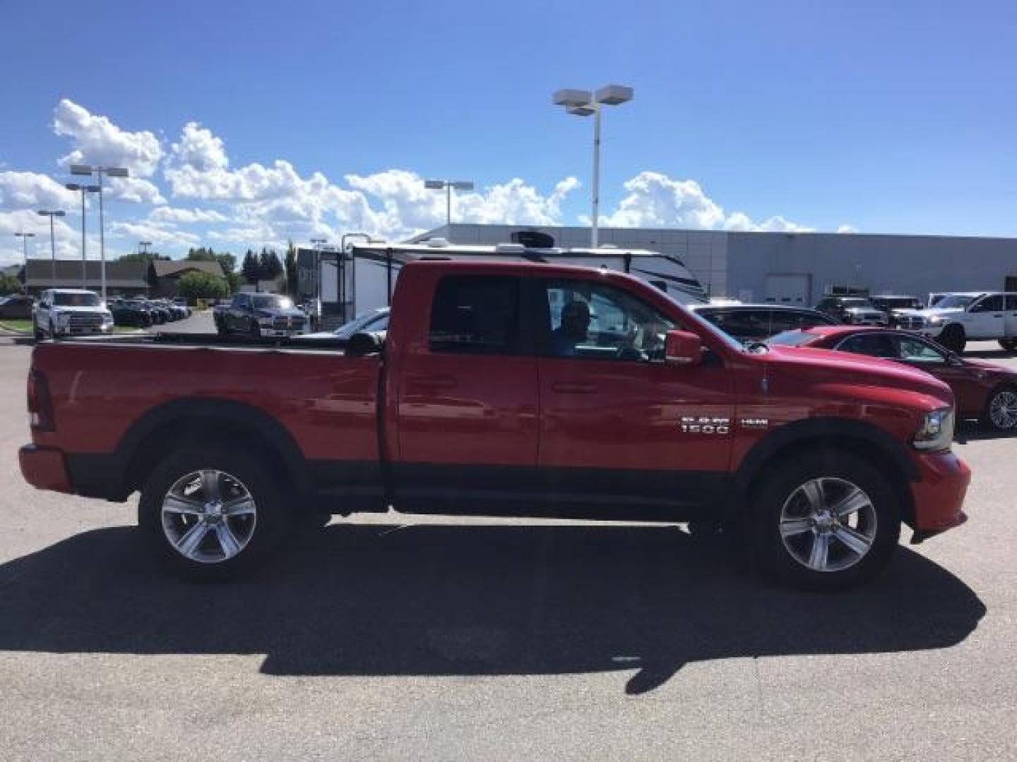 2013 Flame Red /Black Cloth Interior RAM 1500 Sport Quad Cab 4WD (1C6RR7HT4DS) with an 5.7L V8 OHV 16V engine, 6-Speed Automatic transmission, located at 1235 N Woodruff Ave., Idaho Falls, 83401, (208) 523-1053, 43.507172, -112.000488 - Leather, sport package, 4X4, Bluetooth, Alpine Sound System, heated and cooled seats, heated steering wheel, tow package, 6.6' bed, Tonneau cover. At Timberline Auto it is always easy to find a great deal on your next vehicle! Our experienced sales staff can help find the right vehicle that will fi - Photo#5