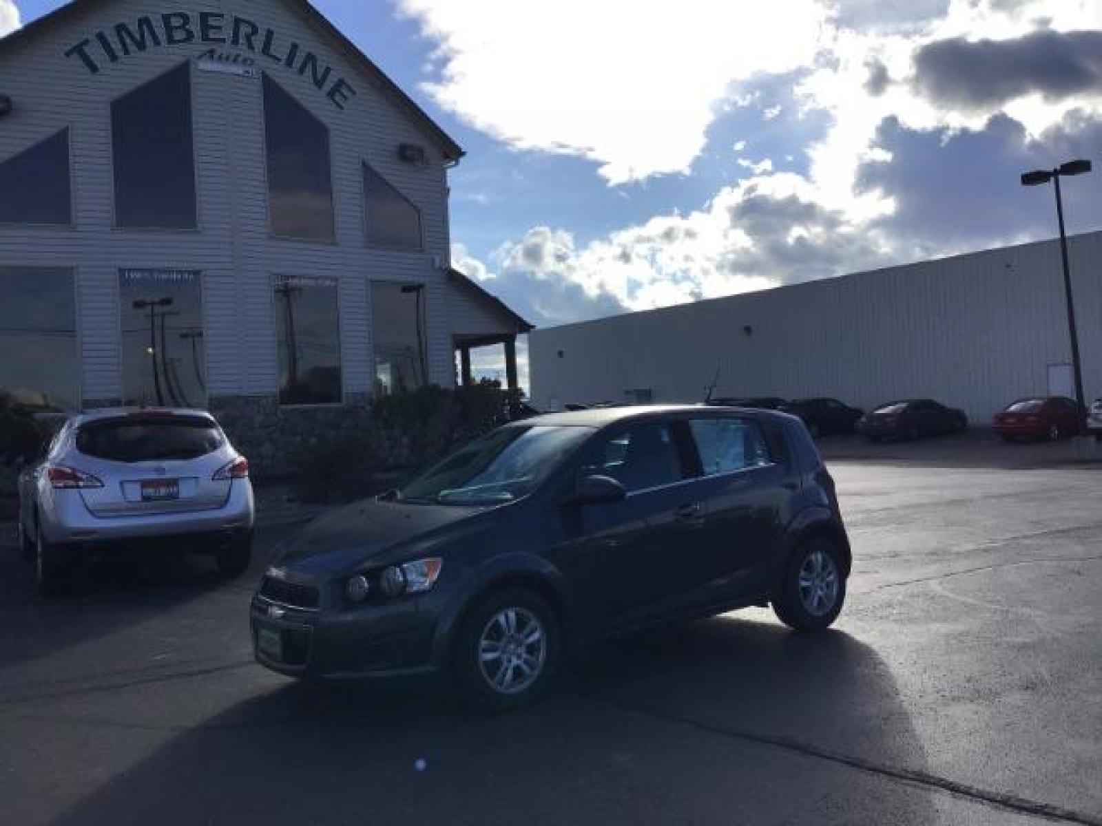 2013 Black Granite Metallic Chevrolet Sonic LT Auto 5-Door (1G1JC6SG7D4) with an 1.8L L4 DOHC 24V engine, 6-Speed Automatic transmission, located at 1235 N Woodruff Ave., Idaho Falls, 83401, (208) 523-1053, 43.507172, -112.000488 - This 2013 Chevrolet Sonic, has the 4 cylinder motor. It has 95,000 miles. It comes with Steering wheel audio controls, cruise control, bluetooth audio, and CD player. At Timberline Auto it is always easy to find a great deal on your next vehicle! Our experienced sales staff can help find the right v - Photo #0