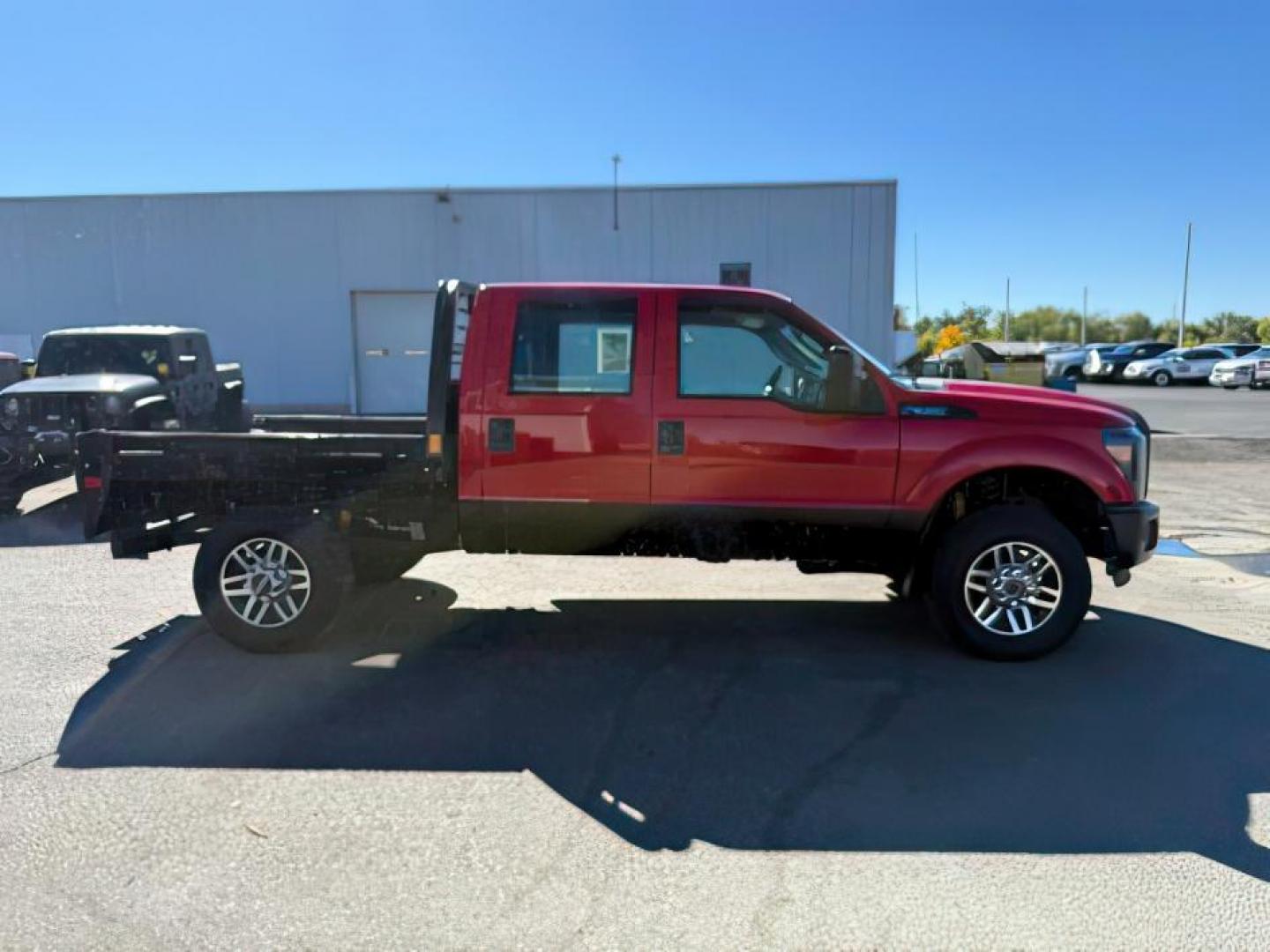 2013 Vermillion Red /Steel Cloth Interior Ford F-350 SD (1FT8W3B60DE) with an 62L V8 OHV 16V engine, Automatic transmission, located at 1175 N Woodruff Ave, Idaho Falls, ID, 83401, 43.506901, -111.999657 - At Timberline Auto, finding a great deal on your next vehicle is always easy! Our experienced sales staff's goal is to help find you the right vehicle at the right price! Our knowledgeable finance department has options for almost any credit score. We offer extended service contract options to prote - Photo#5