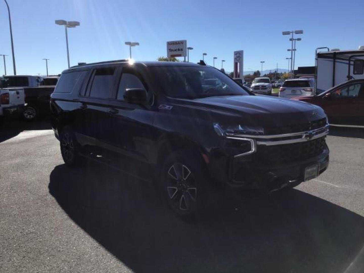 2022 Black /Jet Black Chevrolet Suburban Z71 (1GNSKDKDXNR) with an 5.3L V8 OHV 16V engine, 10-Speed Automatic transmission, located at 1235 N Woodruff Ave., Idaho Falls, 83401, (208) 523-1053, 43.507172, -112.000488 - This 2022 Chevrolet Suburban LT Z71, has the 5.3L V8 motor. It only has 35,683 miles. Comes with leather seats, both fronts seats are powered, heated seats, remote start, back up camera, lane assist, rear climate control, Bose stereo system, Running boards , and it has a towing package. **At Timberl - Photo#5