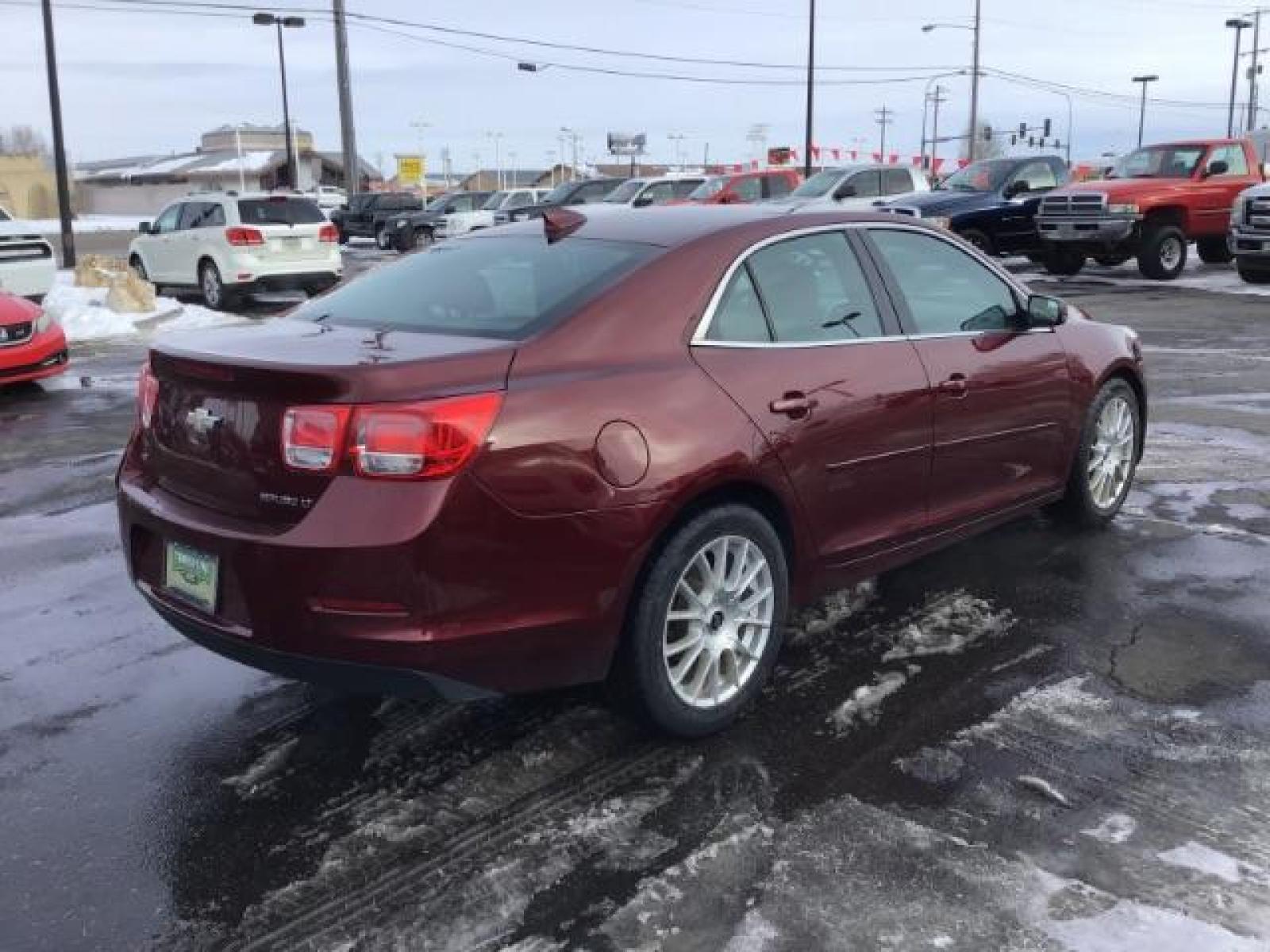 2015 Butte Red Metallic /Jet Black Chevrolet Malibu 2LT (1G11D5SL5FF) with an 2.5L L4 DOHC 16V engine, 6-Speed Automatic transmission, located at 1235 N Woodruff Ave., Idaho Falls, 83401, (208) 523-1053, 43.507172, -112.000488 - This 2015 Chevrolet Malibu 2LT, has 134,000 miles. Comes with Leather interior, heated seats, power seats, blue tooth audio, touch screen stereo, and back up camera. At Timberline Auto it is always easy to find a great deal on your next vehicle! Our experienced sales staff can help find the right v - Photo #4