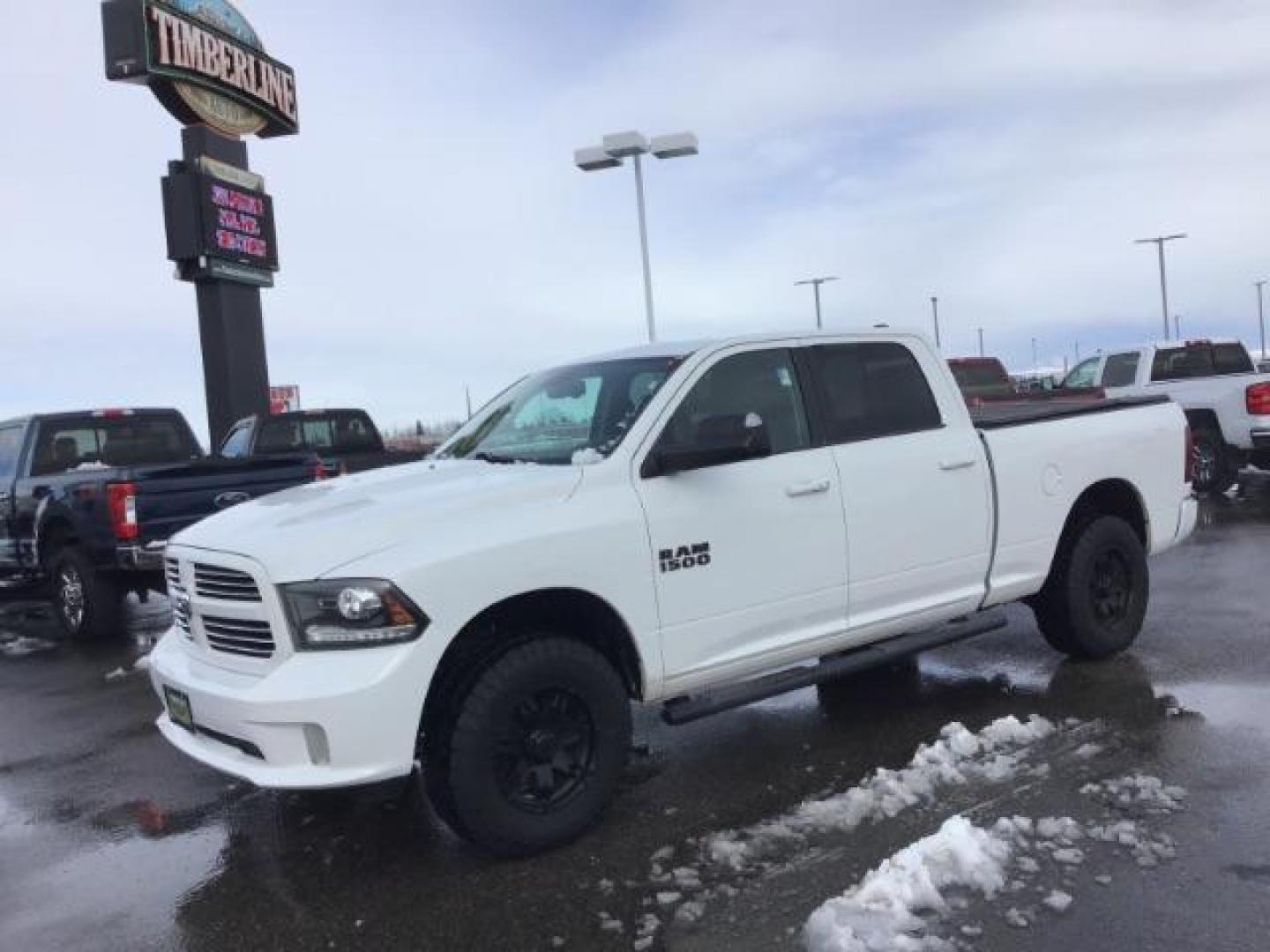 2014 Bright White Clearcoat /Black RAM 1500 Sport Crew Cab LWB 4WD (1C6RR7UT5ES) with an 5.7L V8 OHV 16V engine, 8-Speed Automatic transmission, located at 1235 N Woodruff Ave., Idaho Falls, 83401, (208) 523-1053, 43.507172, -112.000488 - Photo#0