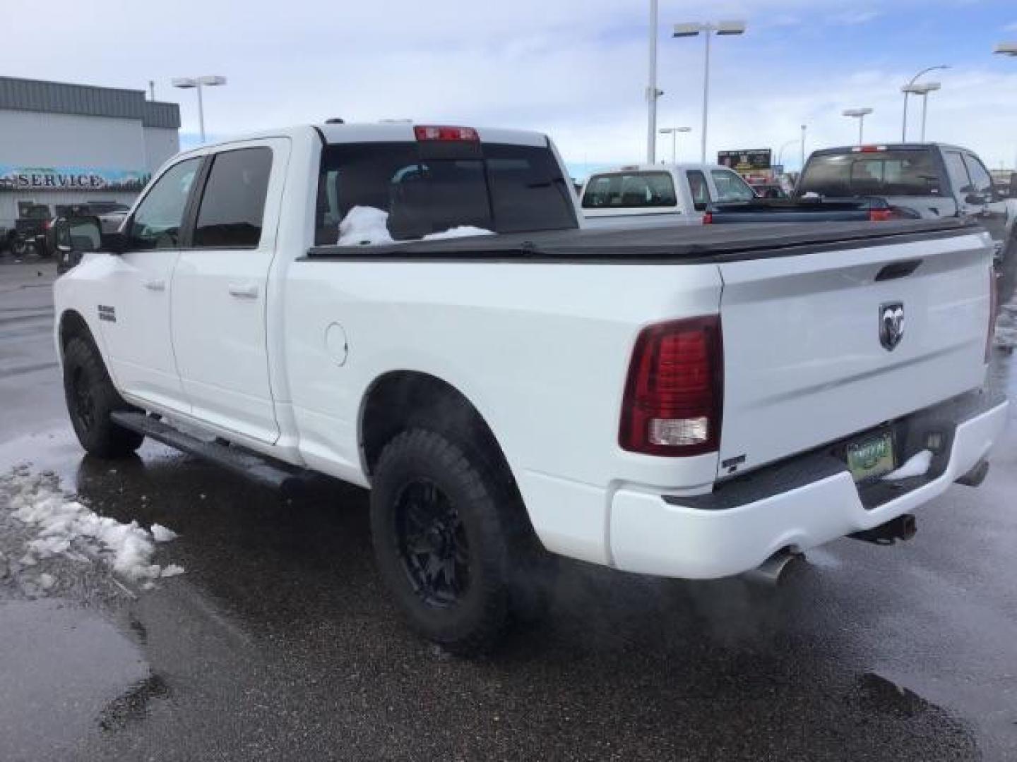 2014 Bright White Clearcoat /Black RAM 1500 Sport Crew Cab LWB 4WD (1C6RR7UT5ES) with an 5.7L V8 OHV 16V engine, 8-Speed Automatic transmission, located at 1235 N Woodruff Ave., Idaho Falls, 83401, (208) 523-1053, 43.507172, -112.000488 - Photo#2