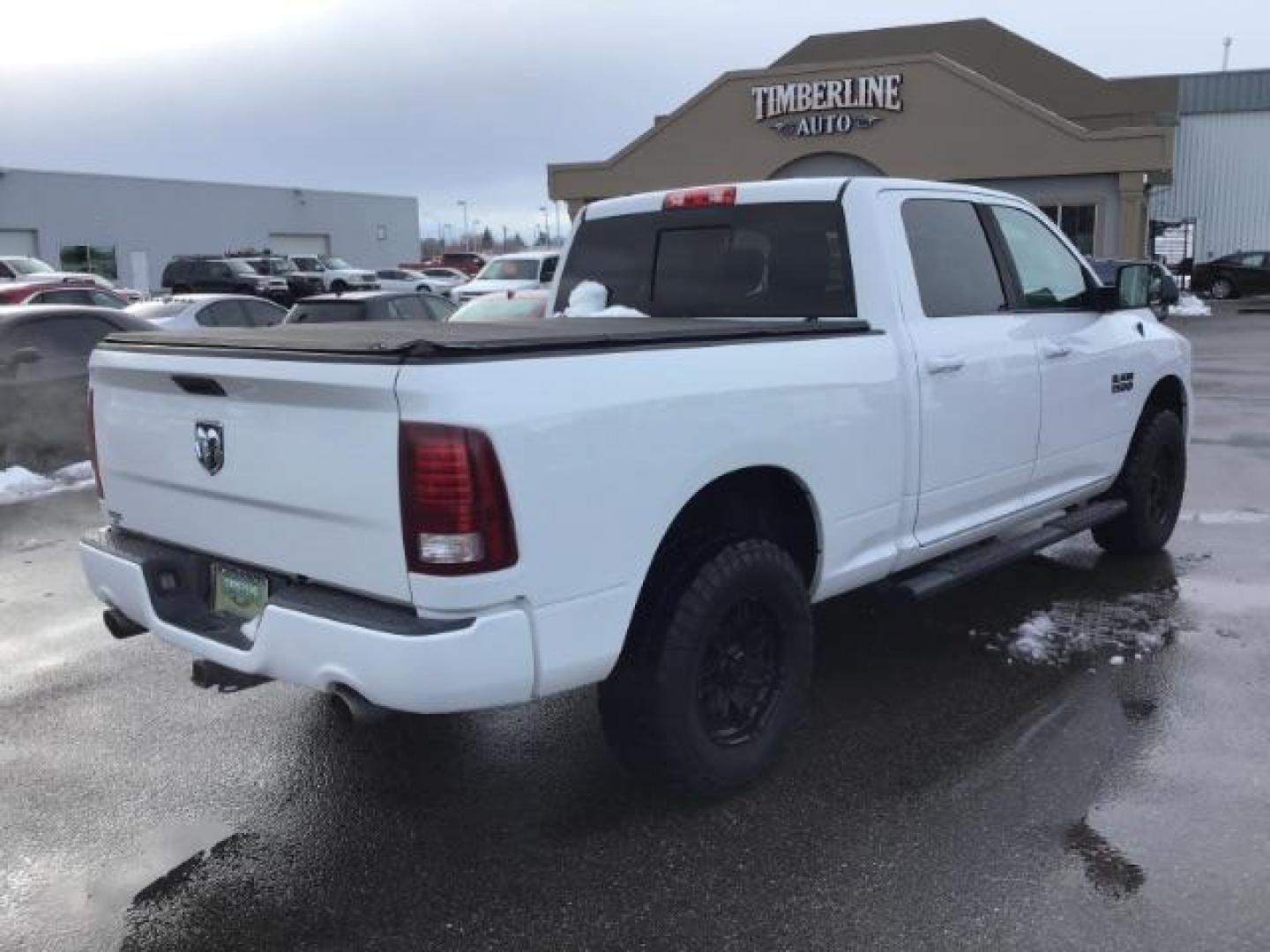 2014 Bright White Clearcoat /Black RAM 1500 Sport Crew Cab LWB 4WD (1C6RR7UT5ES) with an 5.7L V8 OHV 16V engine, 8-Speed Automatic transmission, located at 1235 N Woodruff Ave., Idaho Falls, 83401, (208) 523-1053, 43.507172, -112.000488 - Photo#4