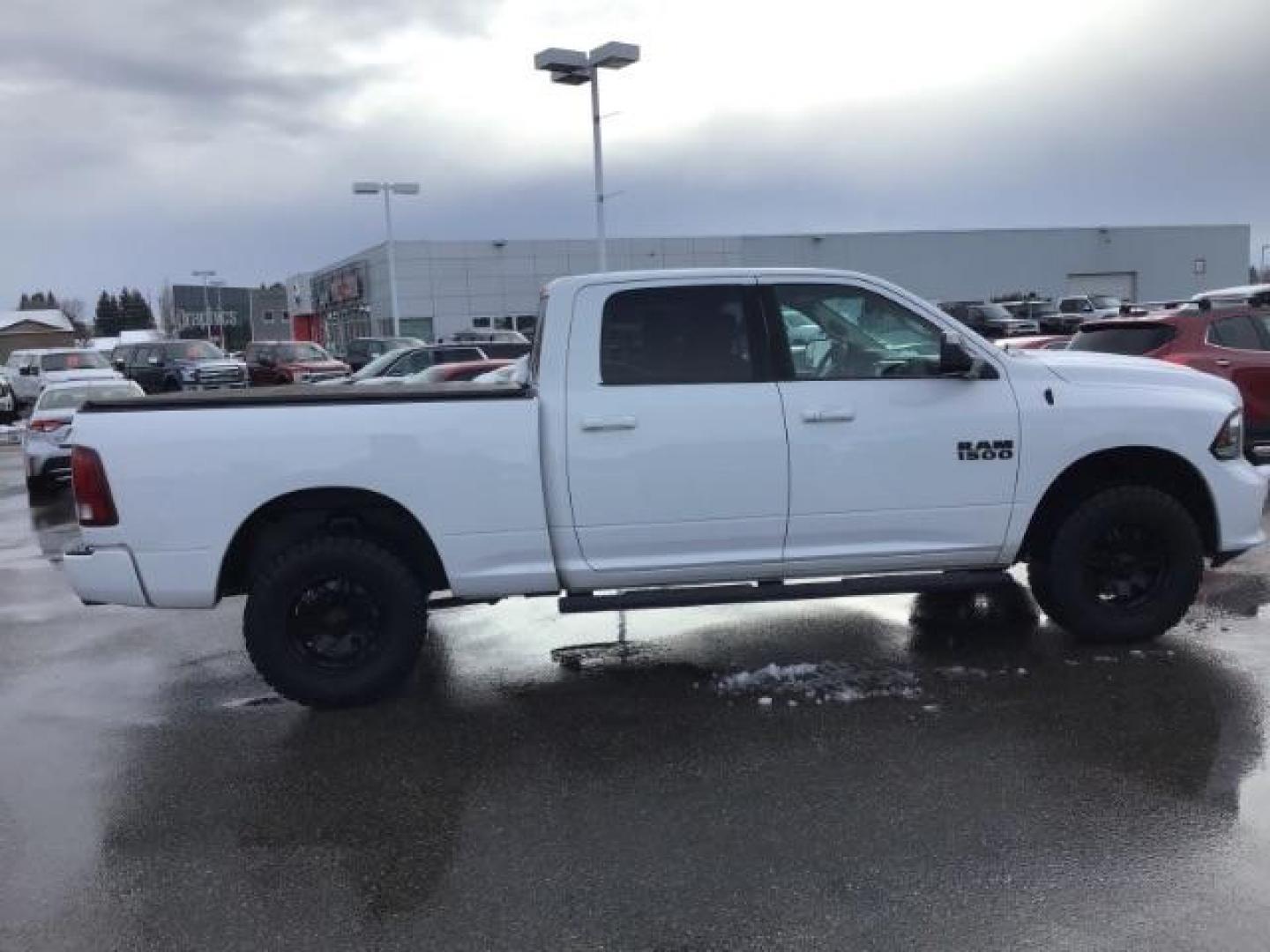 2014 Bright White Clearcoat /Black RAM 1500 Sport Crew Cab LWB 4WD (1C6RR7UT5ES) with an 5.7L V8 OHV 16V engine, 8-Speed Automatic transmission, located at 1235 N Woodruff Ave., Idaho Falls, 83401, (208) 523-1053, 43.507172, -112.000488 - Photo#5