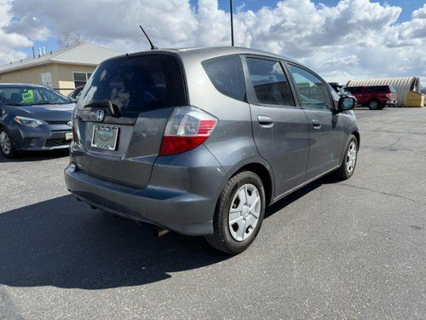 2013 GRAY /Gray Cloth Interior Honda Fit 5-Speed AT (JHMGE8H34DC) with an 1.5L L4 SOHC 16V engine, 5-Speed Automatic transmission, located at 1235 N Woodruff Ave., Idaho Falls, 83401, (208) 523-1053, 43.507172, -112.000488 - Photo#4