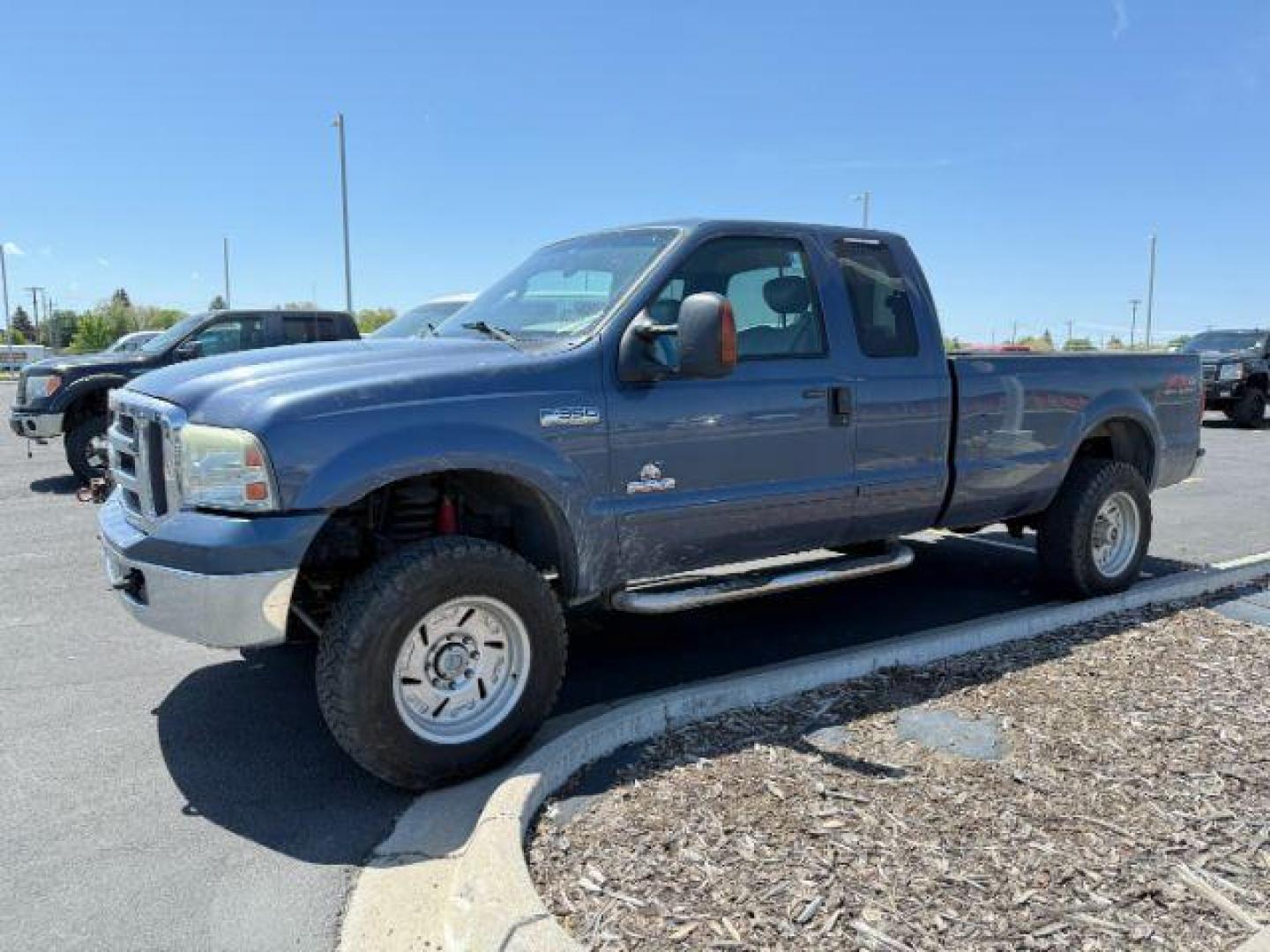 2005 BLUE /Medium Flint Leather Interior Ford F-350 SD Lariat SuperCab 4WD (1FTWX31P55E) with an 6.0L V8 OHV 32V TURBO DIESEL engine, 5-Speed Automatic transmission, located at 1235 N Woodruff Ave., Idaho Falls, 83401, (208) 523-1053, 43.507172, -112.000488 - Photo#0