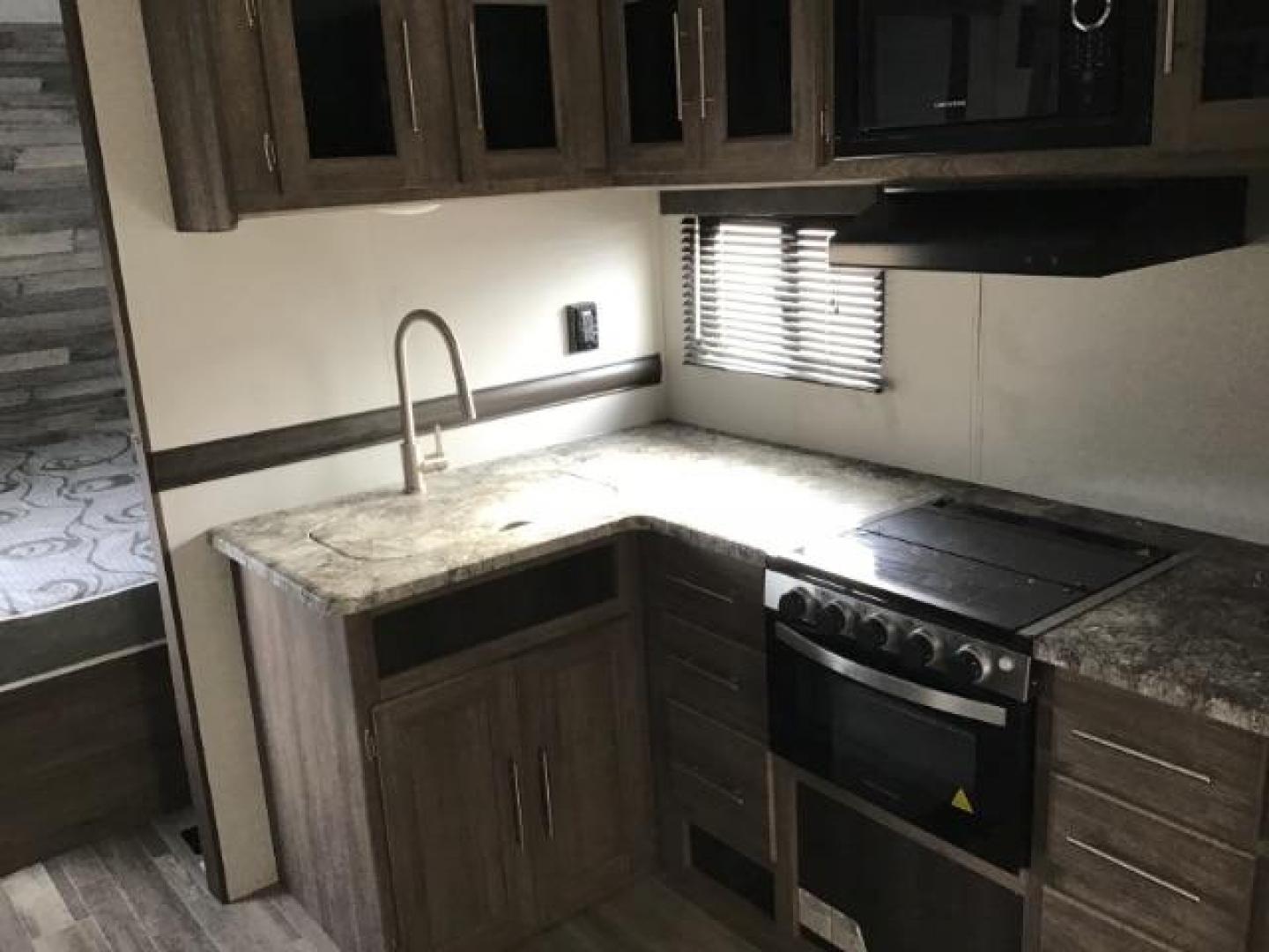 2021 Keystone Unknown - (4YDT28022MS) , located at 1235 N Woodruff Ave., Idaho Falls, 83401, (208) 523-1053, 43.507172, -112.000488 - Floor Plan: The layout of the 280bh model might offer unique features like bunk beds, a large kitchen area, spacious living quarters, etc., making it appealing to families or groups. Amenities: Special amenities such as upgraded appliances, entertainment systems, outdoor kitchens, or slide-out sect - Photo#10