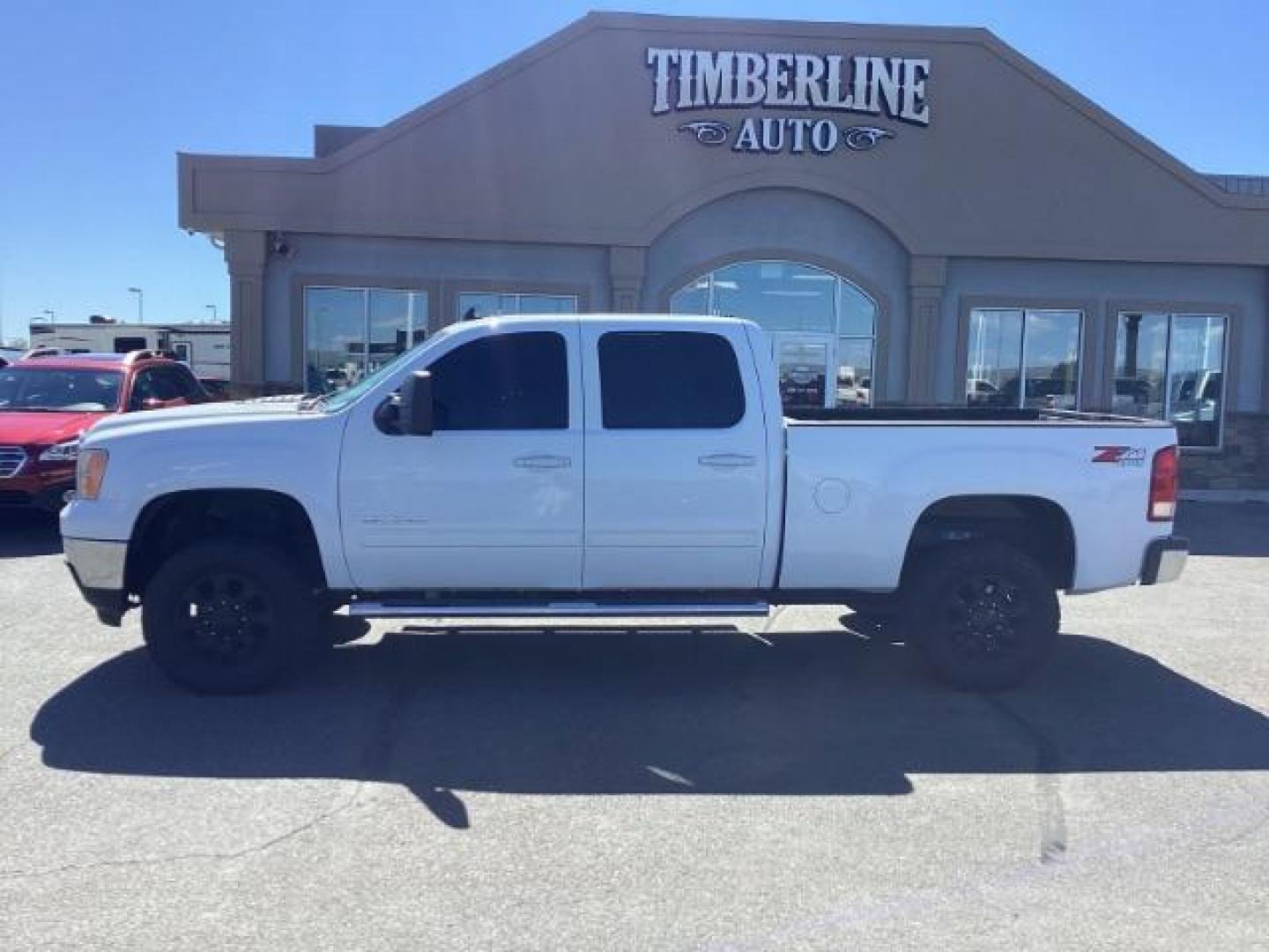 2013 Summit White /Ebony Leather Interior GMC Sierra 2500HD SLT Crew Cab 4WD (1GT121E86DF) with an 6.6L V8 OHV 32V TURBO DIESEL engine, 6-Speed Automatic transmission, located at 1235 N Woodruff Ave., Idaho Falls, 83401, (208) 523-1053, 43.507172, -112.000488 - New Inventory. Going thru service and inspection. Call for more pictures. At Timberline Auto it is always easy to find a great deal on your next vehicle! Our experienced sales staff can help find the right vehicle that will fit your needs. Our knowledgeable finance department has options for almost - Photo#2