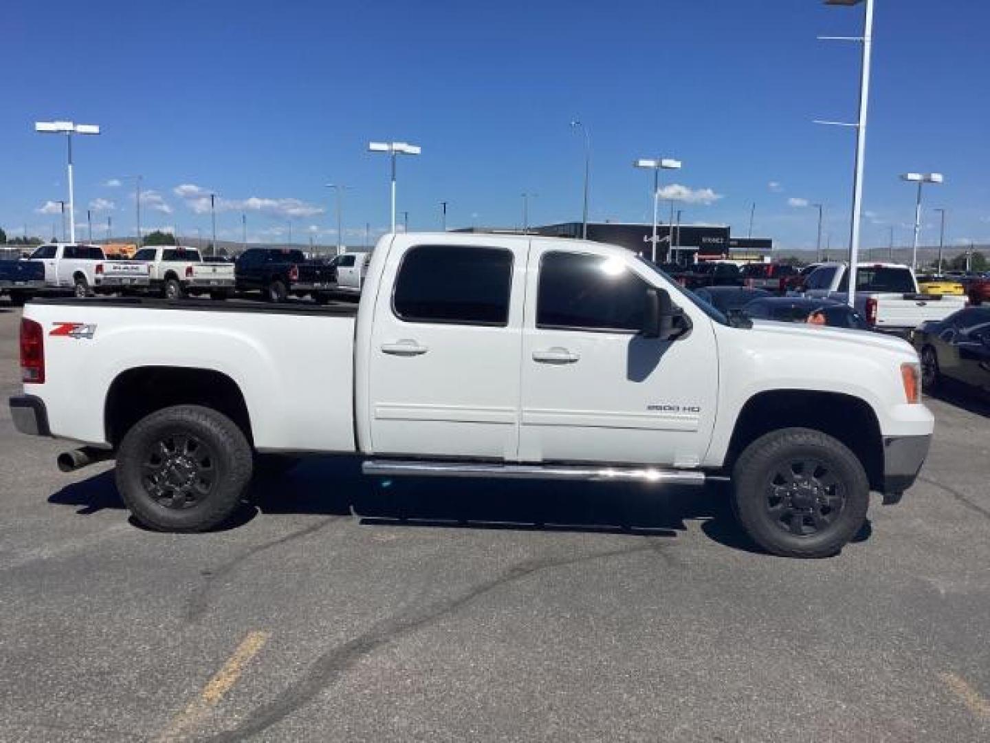 2013 Summit White /Ebony Leather Interior GMC Sierra 2500HD SLT Crew Cab 4WD (1GT121E86DF) with an 6.6L V8 OHV 32V TURBO DIESEL engine, 6-Speed Automatic transmission, located at 1235 N Woodruff Ave., Idaho Falls, 83401, (208) 523-1053, 43.507172, -112.000488 - New Inventory. Going thru service and inspection. Call for more pictures. At Timberline Auto it is always easy to find a great deal on your next vehicle! Our experienced sales staff can help find the right vehicle that will fit your needs. Our knowledgeable finance department has options for almost - Photo#5