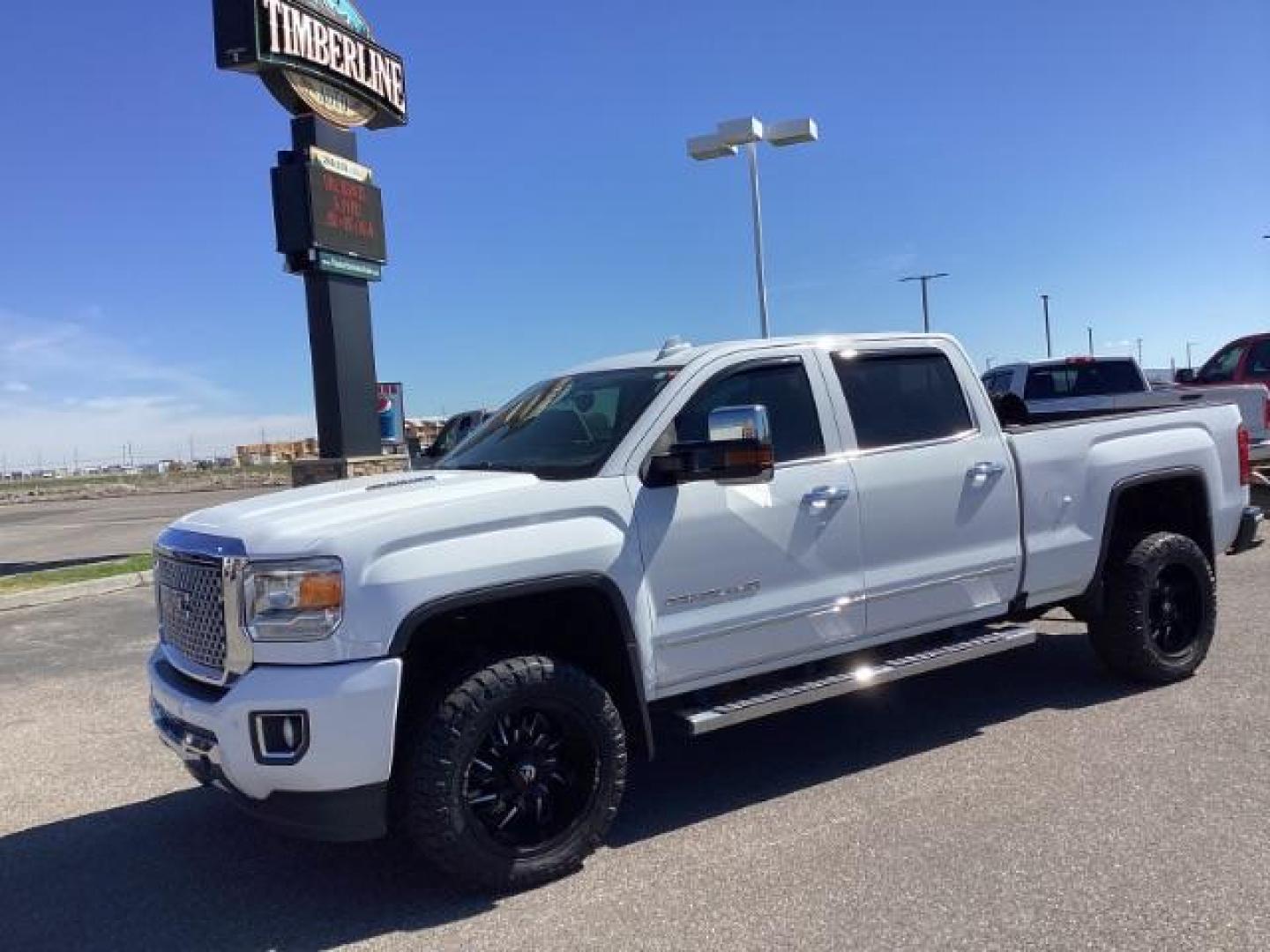 2016 Summit White /Cocoa/Dune, leather GMC Sierra 2500HD Denali Crew Cab 4WD (1GT12UE83GF) with an 6.6L V8 OHV 16 DIESEL engine, 6-Speed Automatic transmission, located at 1235 N Woodruff Ave., Idaho Falls, 83401, (208) 523-1053, 43.507172, -112.000488 - The 2016 GMC Sierra Denali 6.6L typically offers a combination of power, luxury, and capability. Here are some of the key features you can expect to find in this model: Engine: The 6.6-liter V8 turbo diesel engine is one of the standout features of the Sierra Denali. This engine delivers robust per - Photo#0