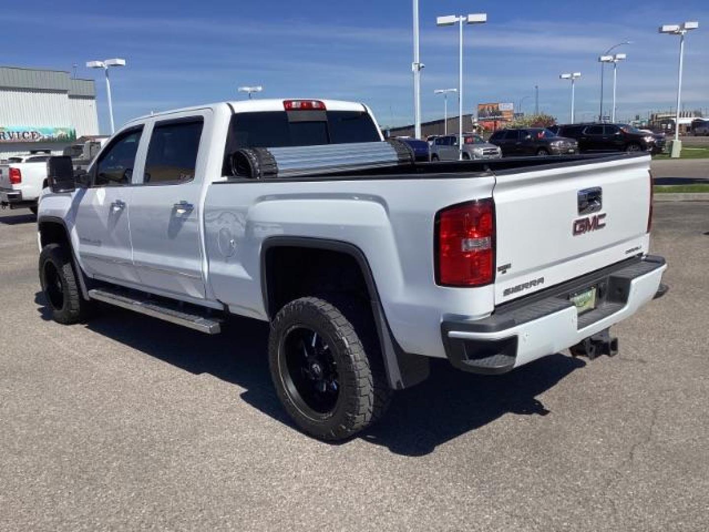 2016 Summit White /Cocoa/Dune, leather GMC Sierra 2500HD Denali Crew Cab 4WD (1GT12UE83GF) with an 6.6L V8 OHV 16 DIESEL engine, 6-Speed Automatic transmission, located at 1235 N Woodruff Ave., Idaho Falls, 83401, (208) 523-1053, 43.507172, -112.000488 - The 2016 GMC Sierra Denali 6.6L typically offers a combination of power, luxury, and capability. Here are some of the key features you can expect to find in this model: Engine: The 6.6-liter V8 turbo diesel engine is one of the standout features of the Sierra Denali. This engine delivers robust per - Photo#2