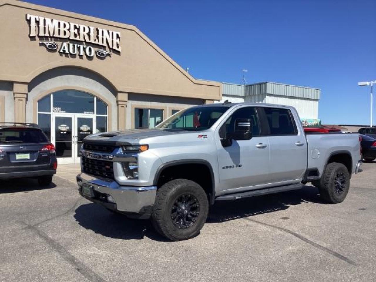 2021 SILVER /Jet Black, leather Chevrolet Silverado 2500HD LT Crew Cab Short Box 4WD (1GC4YNEY1MF) with an 6.6L V8 OHV 16V DIESEL engine, 6-Speed Automatic transmission, located at 1235 N Woodruff Ave., Idaho Falls, 83401, (208) 523-1053, 43.507172, -112.000488 - Photo#0