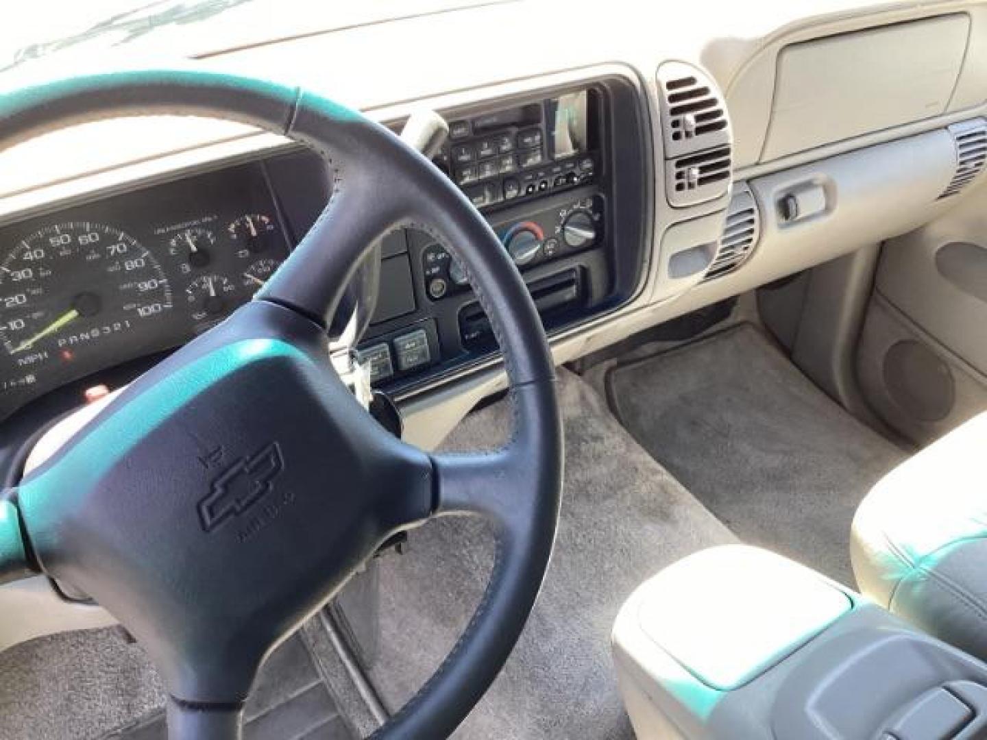 1999 Victory Red /Gray Leather Chevrolet Tahoe 4-Door 4WD (1GNEK13R6XJ) with an 5.7L V8 OHV 16V engine, 4-Speed Automatic transmission, located at 1235 N Woodruff Ave., Idaho Falls, 83401, (208) 523-1053, 43.507172, -112.000488 - The 1999 Chevrolet Tahoe is a full-size SUV known for its rugged performance, spacious interior, and towing capability. Here are the key features of the 1999 Chevrolet Tahoe: Engine and Performance Engine Options: 5.7-liter V8: Produces 255 horsepower and 330 lb-ft of torque. Transmission: 4-speed - Photo#9