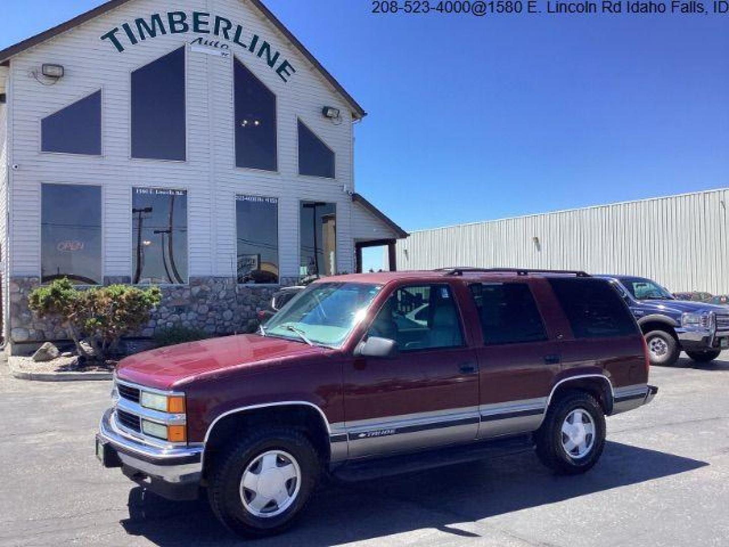 1999 Victory Red /Gray Leather Chevrolet Tahoe 4-Door 4WD (1GNEK13R6XJ) with an 5.7L V8 OHV 16V engine, 4-Speed Automatic transmission, located at 1235 N Woodruff Ave., Idaho Falls, 83401, (208) 523-1053, 43.507172, -112.000488 - The 1999 Chevrolet Tahoe is a full-size SUV known for its rugged performance, spacious interior, and towing capability. Here are the key features of the 1999 Chevrolet Tahoe: Engine and Performance Engine Options: 5.7-liter V8: Produces 255 horsepower and 330 lb-ft of torque. Transmission: 4-speed - Photo#0