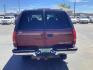1999 Victory Red /Gray Leather Chevrolet Tahoe 4-Door 4WD (1GNEK13R6XJ) with an 5.7L V8 OHV 16V engine, 4-Speed Automatic transmission, located at 1235 N Woodruff Ave., Idaho Falls, 83401, (208) 523-1053, 43.507172, -112.000488 - The 1999 Chevrolet Tahoe is a full-size SUV known for its rugged performance, spacious interior, and towing capability. Here are the key features of the 1999 Chevrolet Tahoe: Engine and Performance Engine Options: 5.7-liter V8: Produces 255 horsepower and 330 lb-ft of torque. Transmission: 4-speed - Photo#1