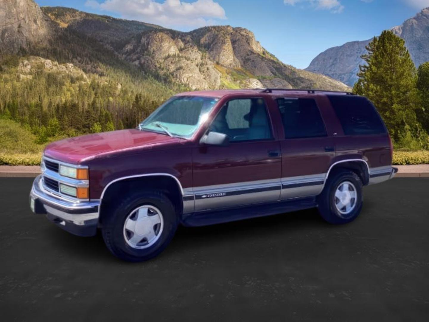 1999 Victory Red /Gray Leather Chevrolet Tahoe 4-Door 4WD (1GNEK13R6XJ) with an 5.7L V8 OHV 16V engine, 4-Speed Automatic transmission, located at 1235 N Woodruff Ave., Idaho Falls, 83401, (208) 523-1053, 43.507172, -112.000488 - The 1999 Chevrolet Tahoe is a full-size SUV known for its rugged performance, spacious interior, and towing capability. Here are the key features of the 1999 Chevrolet Tahoe: Engine and Performance Engine Options: 5.7-liter V8: Produces 255 horsepower and 330 lb-ft of torque. Transmission: 4-speed - Photo#0