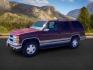 1999 Victory Red /Gray Leather Chevrolet Tahoe 4-Door 4WD (1GNEK13R6XJ) with an 5.7L V8 OHV 16V engine, 4-Speed Automatic transmission, located at 1235 N Woodruff Ave., Idaho Falls, 83401, (208) 523-1053, 43.507172, -112.000488 - The 1999 Chevrolet Tahoe is a full-size SUV known for its rugged performance, spacious interior, and towing capability. Here are the key features of the 1999 Chevrolet Tahoe: Engine and Performance Engine Options: 5.7-liter V8: Produces 255 horsepower and 330 lb-ft of torque. Transmission: 4-speed - Photo#0