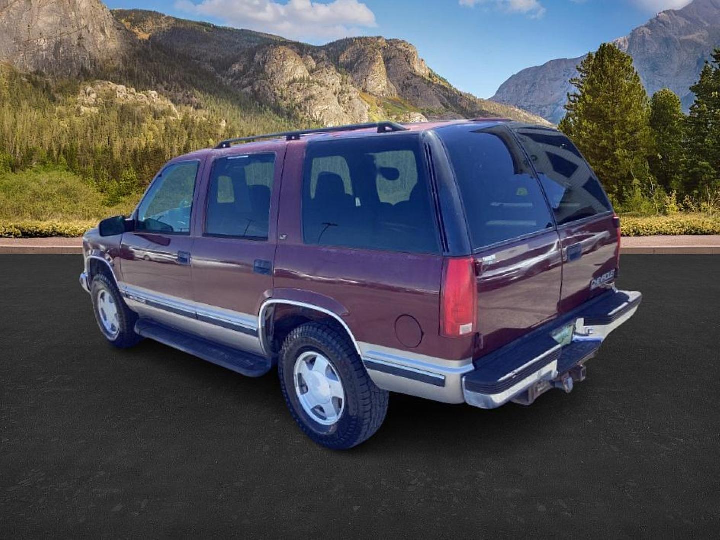 1999 Victory Red /Gray Leather Chevrolet Tahoe 4-Door 4WD (1GNEK13R6XJ) with an 5.7L V8 OHV 16V engine, 4-Speed Automatic transmission, located at 1235 N Woodruff Ave., Idaho Falls, 83401, (208) 523-1053, 43.507172, -112.000488 - The 1999 Chevrolet Tahoe is a full-size SUV known for its rugged performance, spacious interior, and towing capability. Here are the key features of the 1999 Chevrolet Tahoe: Engine and Performance Engine Options: 5.7-liter V8: Produces 255 horsepower and 330 lb-ft of torque. Transmission: 4-speed - Photo#2