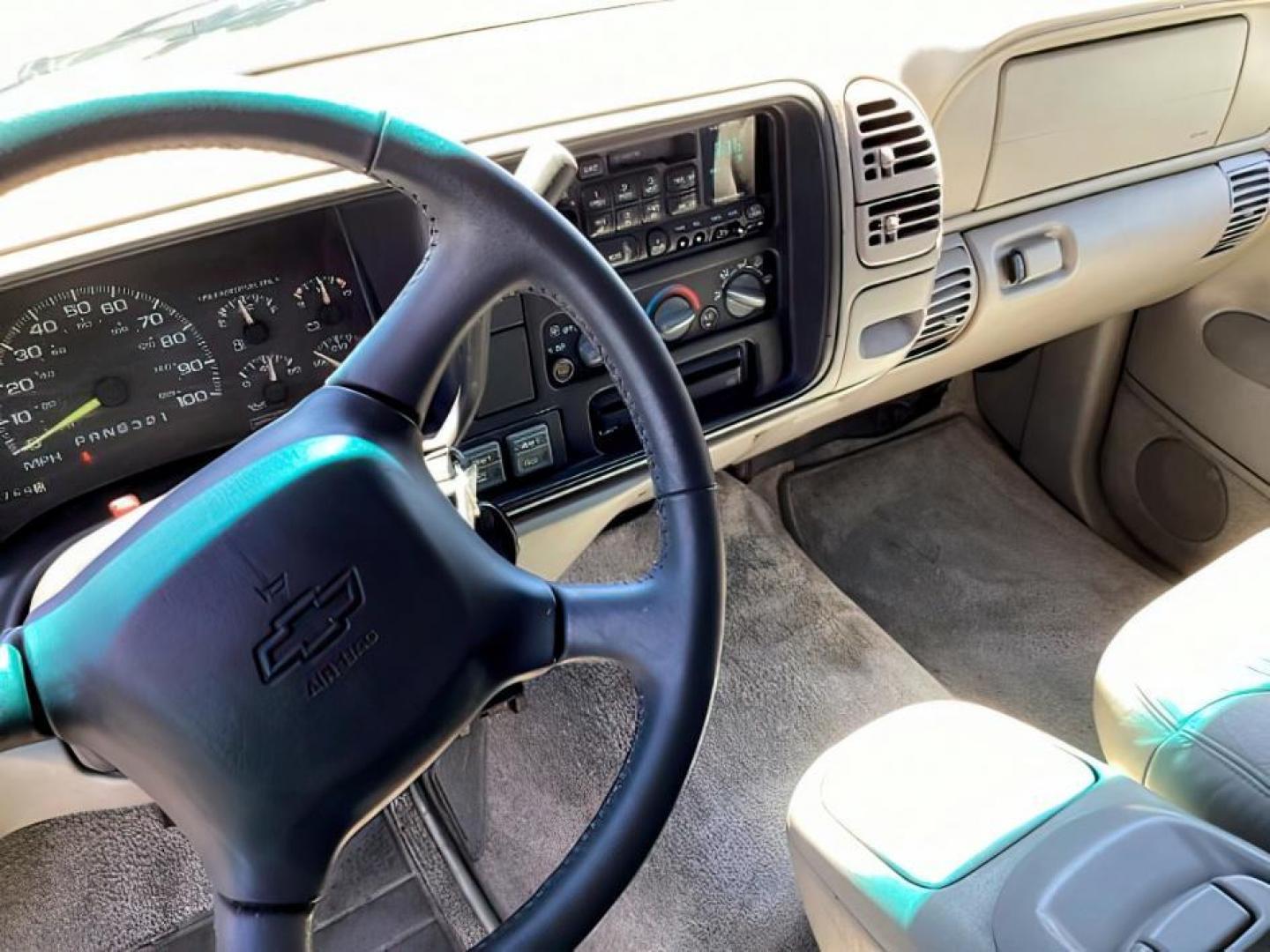 1999 Victory Red /Gray Leather Chevrolet Tahoe 4-Door 4WD (1GNEK13R6XJ) with an 5.7L V8 OHV 16V engine, 4-Speed Automatic transmission, located at 1235 N Woodruff Ave., Idaho Falls, 83401, (208) 523-1053, 43.507172, -112.000488 - The 1999 Chevrolet Tahoe is a full-size SUV known for its rugged performance, spacious interior, and towing capability. Here are the key features of the 1999 Chevrolet Tahoe: Engine and Performance Engine Options: 5.7-liter V8: Produces 255 horsepower and 330 lb-ft of torque. Transmission: 4-speed - Photo#9
