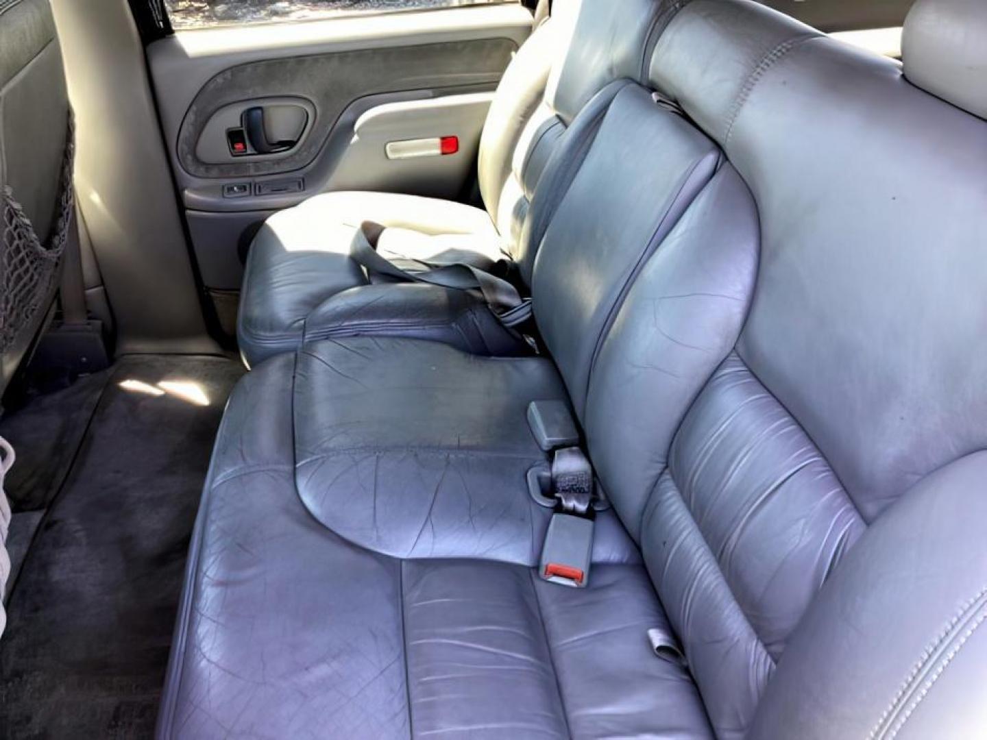 1999 Victory Red /Gray Leather Chevrolet Tahoe 4-Door 4WD (1GNEK13R6XJ) with an 5.7L V8 OHV 16V engine, 4-Speed Automatic transmission, located at 1235 N Woodruff Ave., Idaho Falls, 83401, (208) 523-1053, 43.507172, -112.000488 - The 1999 Chevrolet Tahoe is a full-size SUV known for its rugged performance, spacious interior, and towing capability. Here are the key features of the 1999 Chevrolet Tahoe: Engine and Performance Engine Options: 5.7-liter V8: Produces 255 horsepower and 330 lb-ft of torque. Transmission: 4-speed - Photo#11