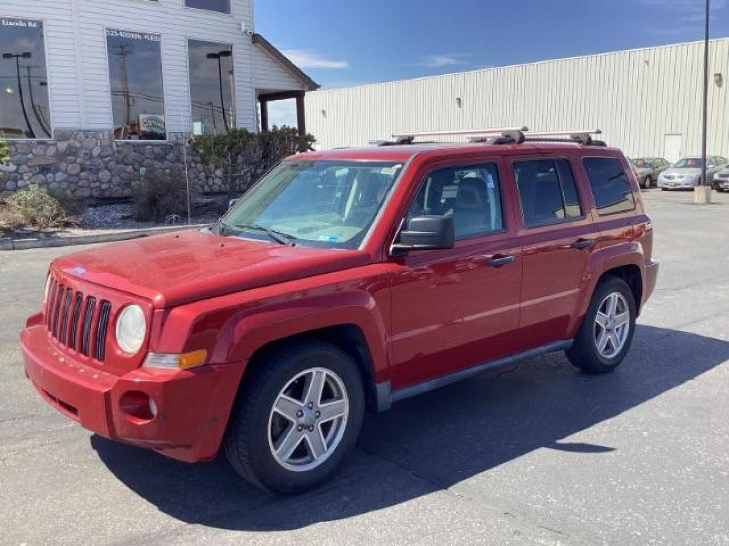 2008 Inferno Red Crystal Pearl /Dark Slate Gray Cloth Interior Jeep Patriot Sport 4WD (1J8FF28W28D) with an 2.4L L4 DOHC 16V engine, located at 1235 N Woodruff Ave., Idaho Falls, 83401, (208) 523-1053, 43.507172, -112.000488 - Photo#0