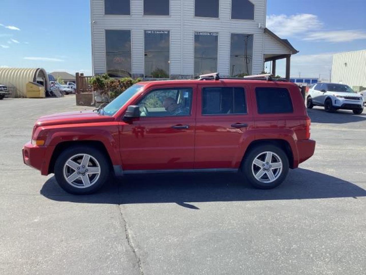 2008 Inferno Red Crystal Pearl /Dark Slate Gray Cloth Interior Jeep Patriot Sport 4WD (1J8FF28W28D) with an 2.4L L4 DOHC 16V engine, located at 1235 N Woodruff Ave., Idaho Falls, 83401, (208) 523-1053, 43.507172, -112.000488 - Photo#1