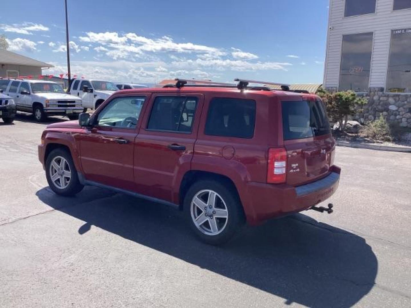 2008 Inferno Red Crystal Pearl /Dark Slate Gray Cloth Interior Jeep Patriot Sport 4WD (1J8FF28W28D) with an 2.4L L4 DOHC 16V engine, located at 1235 N Woodruff Ave., Idaho Falls, 83401, (208) 523-1053, 43.507172, -112.000488 - Photo#2