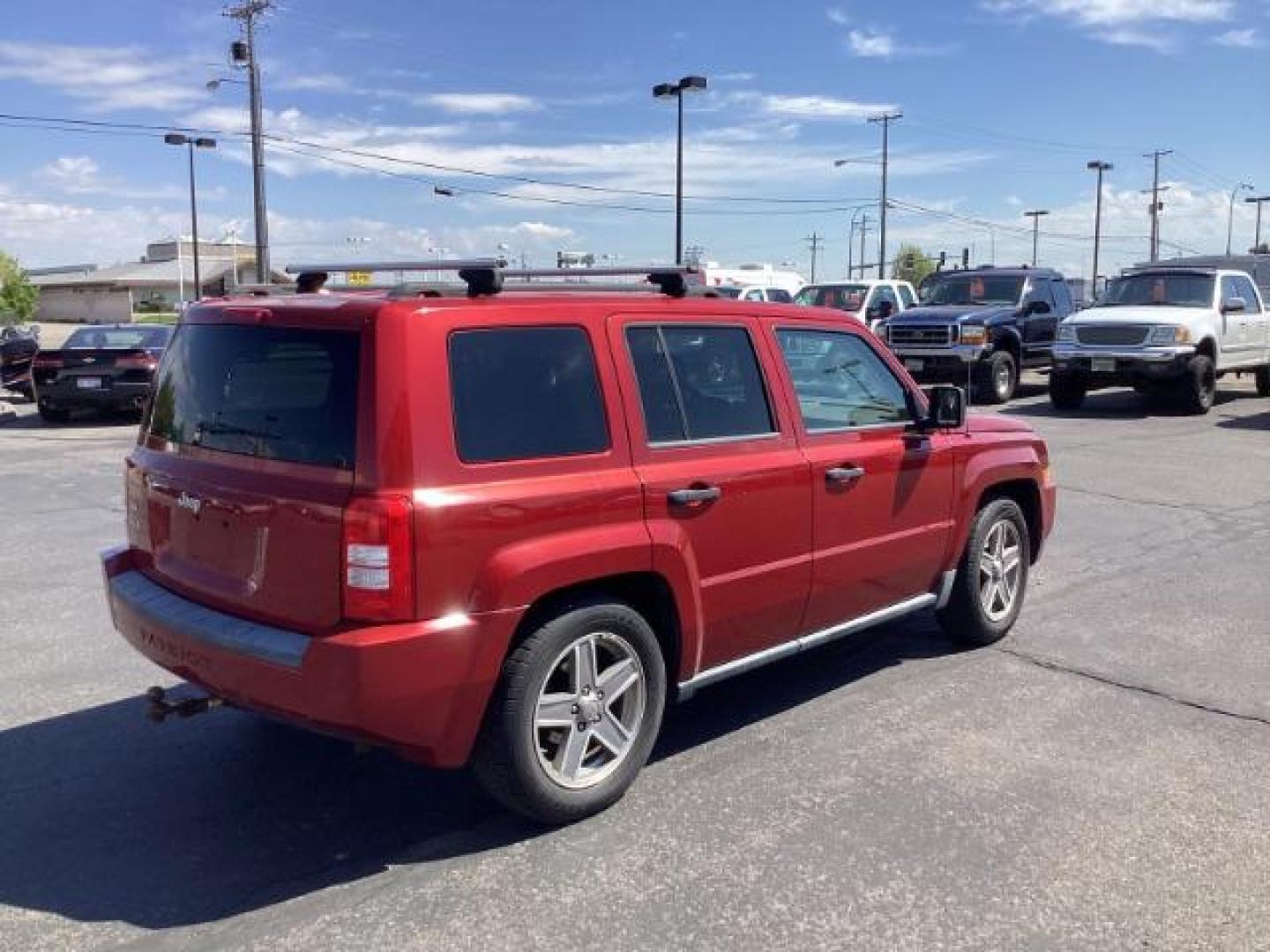 2008 Inferno Red Crystal Pearl /Dark Slate Gray Cloth Interior Jeep Patriot Sport 4WD (1J8FF28W28D) with an 2.4L L4 DOHC 16V engine, located at 1235 N Woodruff Ave., Idaho Falls, 83401, (208) 523-1053, 43.507172, -112.000488 - Photo#4