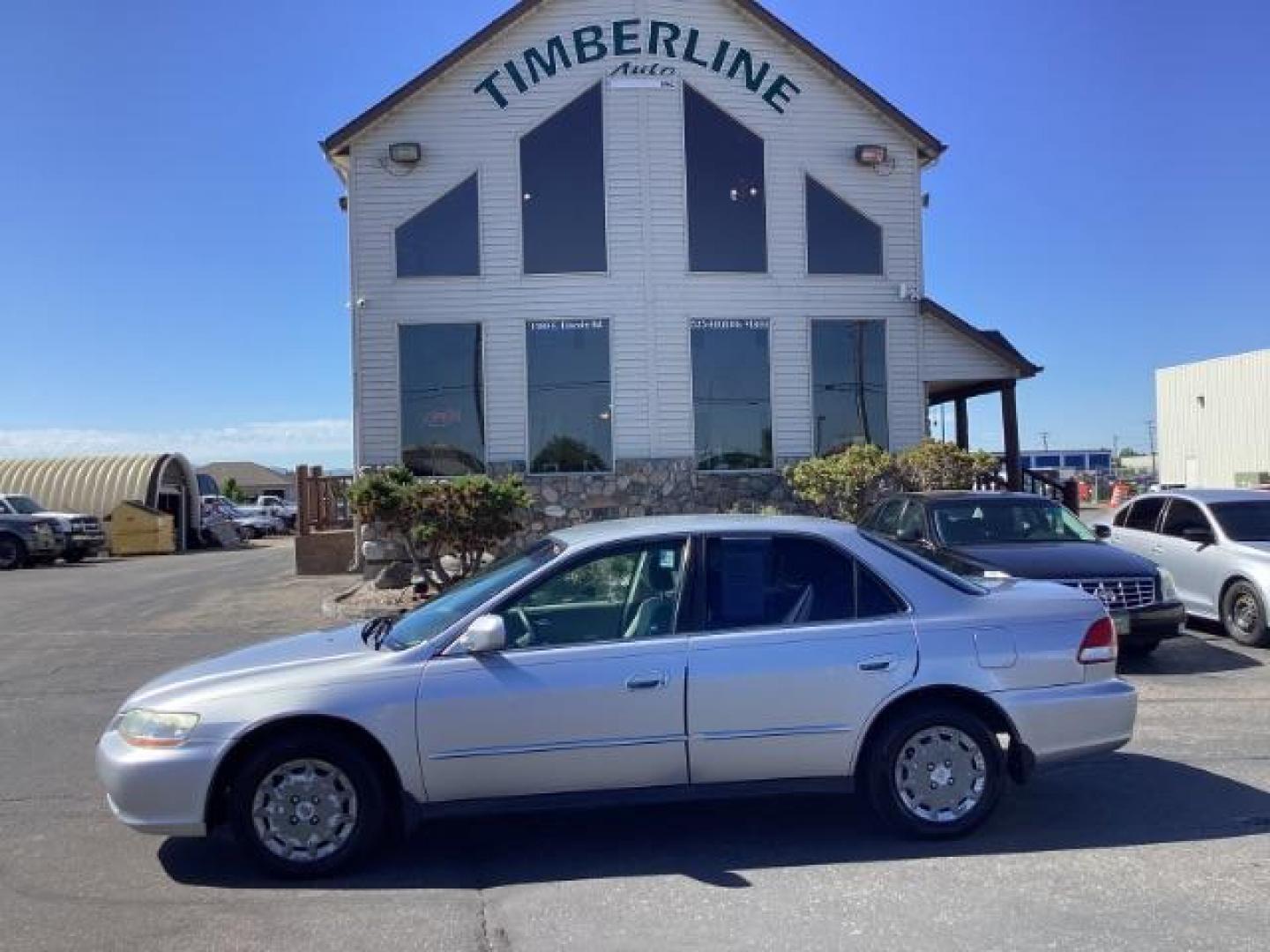 2002 SILVER /Ivory Cloth Interior Honda Accord LX sedan (JHMCG56412C) with an 2.3L L4 SOHC 16V engine, 4-Speed Automatic transmission, located at 1235 N Woodruff Ave., Idaho Falls, 83401, (208) 523-1053, 43.507172, -112.000488 - The 2002 Honda Accord LX is a mid-size sedan that is known for its reliability, comfort, and practicality. Here are the key features of the 2002 Honda Accord LX: Engine and Performance Engine Options: 2.3-liter inline-4: Produces 150 horsepower and 152 lb-ft of torque Transmission: 5-speed manual t - Photo#1