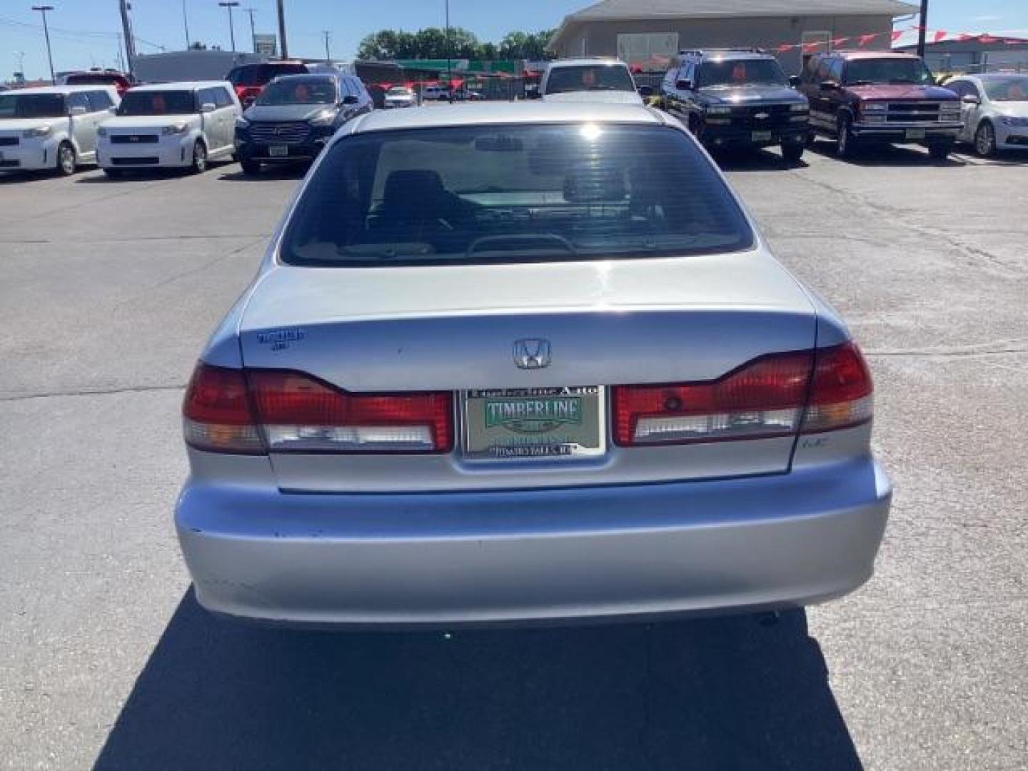 2002 SILVER /Ivory Cloth Interior Honda Accord LX sedan (JHMCG56412C) with an 2.3L L4 SOHC 16V engine, 4-Speed Automatic transmission, located at 1235 N Woodruff Ave., Idaho Falls, 83401, (208) 523-1053, 43.507172, -112.000488 - The 2002 Honda Accord LX is a mid-size sedan that is known for its reliability, comfort, and practicality. Here are the key features of the 2002 Honda Accord LX: Engine and Performance Engine Options: 2.3-liter inline-4: Produces 150 horsepower and 152 lb-ft of torque Transmission: 5-speed manual t - Photo#2