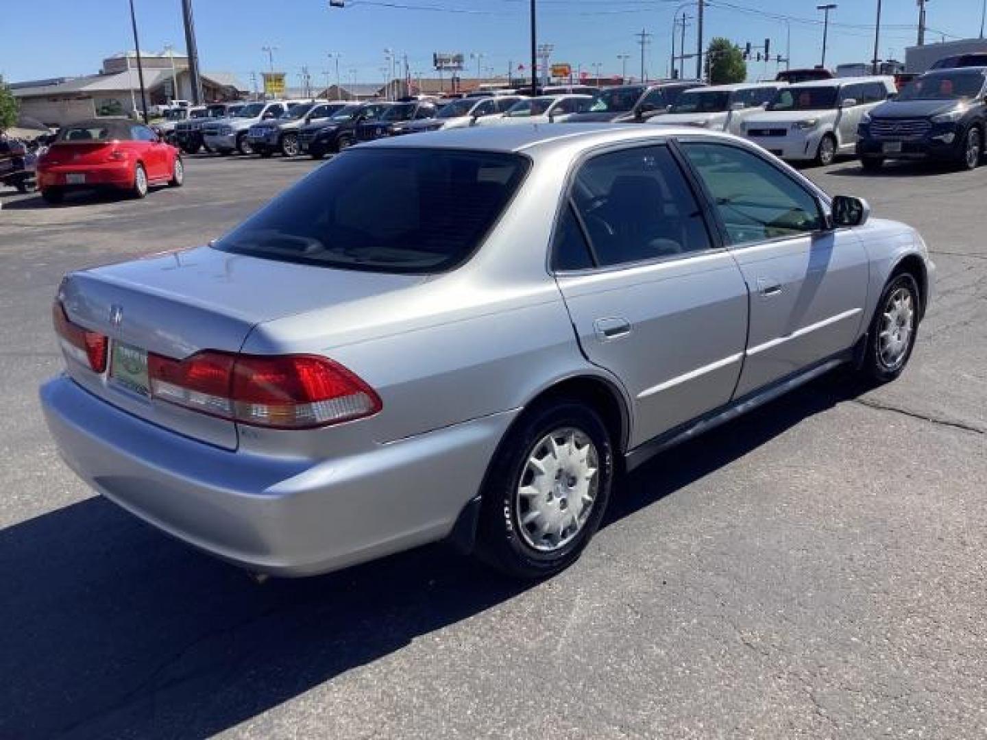 2002 SILVER /Ivory Cloth Interior Honda Accord LX sedan (JHMCG56412C) with an 2.3L L4 SOHC 16V engine, 4-Speed Automatic transmission, located at 1235 N Woodruff Ave., Idaho Falls, 83401, (208) 523-1053, 43.507172, -112.000488 - The 2002 Honda Accord LX is a mid-size sedan that is known for its reliability, comfort, and practicality. Here are the key features of the 2002 Honda Accord LX: Engine and Performance Engine Options: 2.3-liter inline-4: Produces 150 horsepower and 152 lb-ft of torque Transmission: 5-speed manual t - Photo#4