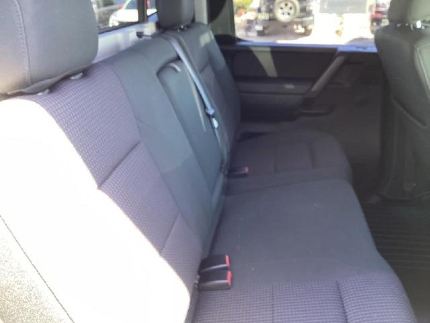 2009 Nissan Titan SE Crew Cab 4WD SWB (1N6AA07C29N) with an 5.6L V8 DOHC 32V engine, 5-Speed Automatic transmission, located at 1235 N Woodruff Ave., Idaho Falls, 83401, (208) 523-1053, 43.507172, -112.000488 - ChatGPT The 2009 Nissan Titan SE 4x4 was a rugged and capable full-size pickup truck that offered a variety of features suitable for both work and everyday use. Here are some of the common features found on the 2009 Nissan Titan SE 4x4: Engine: The Titan SE 4x4 typically came equipped with a powerf - Photo#14