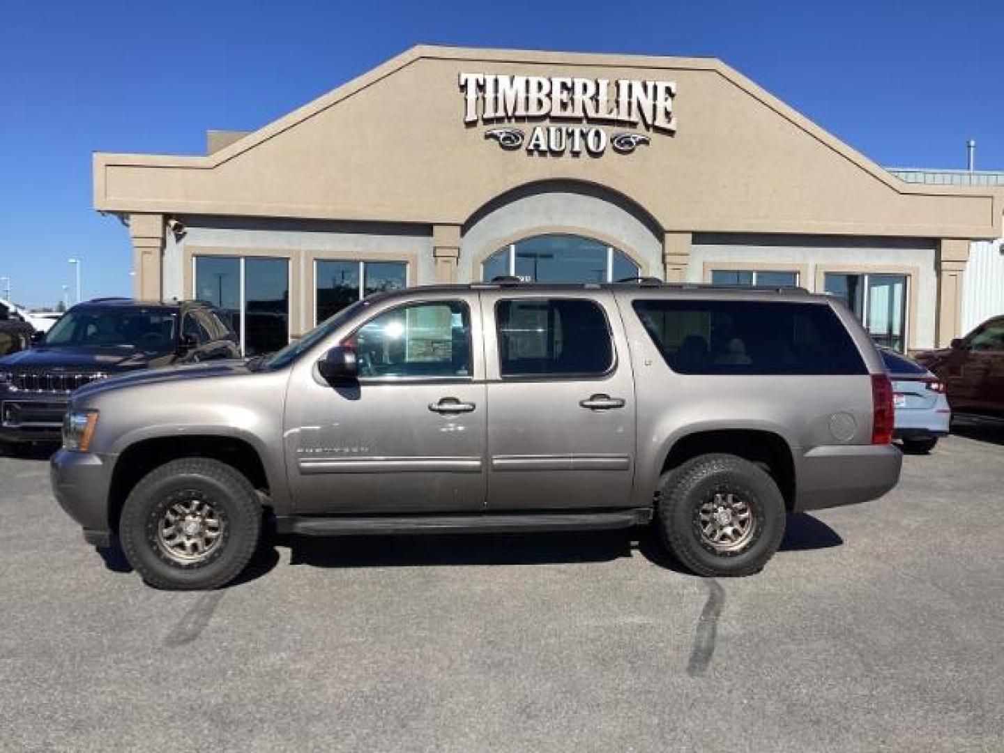 2013 GRAY /Ebony Leather Interior Chevrolet Suburban LTZ 1500 4WD (1GNSKJE71DR) with an 5.3L V8 OHV 16V FFV engine, 6-Speed Automatic transmission, located at 1235 N Woodruff Ave., Idaho Falls, 83401, (208) 523-1053, 43.507172, -112.000488 - At Timberline Auto, finding a great deal on your next vehicle is always easy! Our experienced sales staff's goal is to help find you the right vehicle at the right price! Our knowledgeable finance department has options for almost any credit score. We offer extended service contract options to prote - Photo#1
