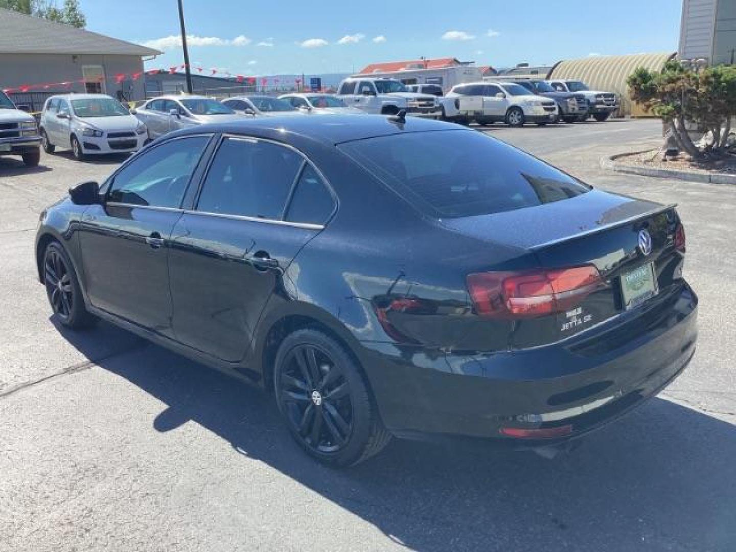 2018 Black /Titan Black w/Black Headliner, leatherette Volkswagen Jetta Sport 6A (3VWD17AJ7JM) with an 1.8L L4 DOHC 16V engine, 6-Speed Automatic transmission, located at 1235 N Woodruff Ave., Idaho Falls, 83401, (208) 523-1053, 43.507172, -112.000488 - The 2018 Volkswagen Jetta SE is a compact sedan that combines comfort, technology, and performance. Here is an overview of the key features of the 2018 Volkswagen Jetta SE: Engine and Performance Engine: 1.4-liter turbocharged inline-4 Horsepower: 150 hp @ 5,000 rpm Torque: 184 lb-ft @ 1,400-3,500 - Photo#2