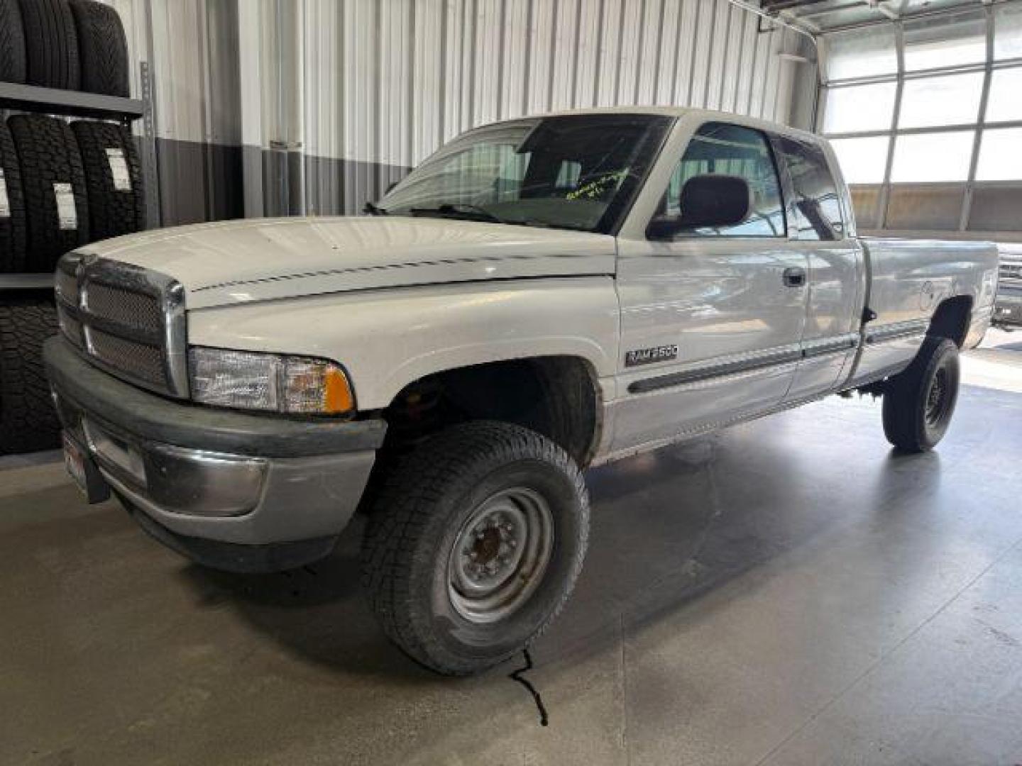 1999 WHITE /CLOTH Dodge Ram 2500 (1B7KF2365XJ) with an 59 engine, Manual transmission, located at 1175 N Woodruff Ave, Idaho Falls, ID, 83401, 43.506901, -111.999657 - At Timberline Auto, finding a great deal on your next vehicle is always easy! Our experienced sales staff's goal is to help find you the right vehicle at the right price! Our knowledgeable finance department has options for almost any credit score. We offer extended service contract options to prote - Photo#1