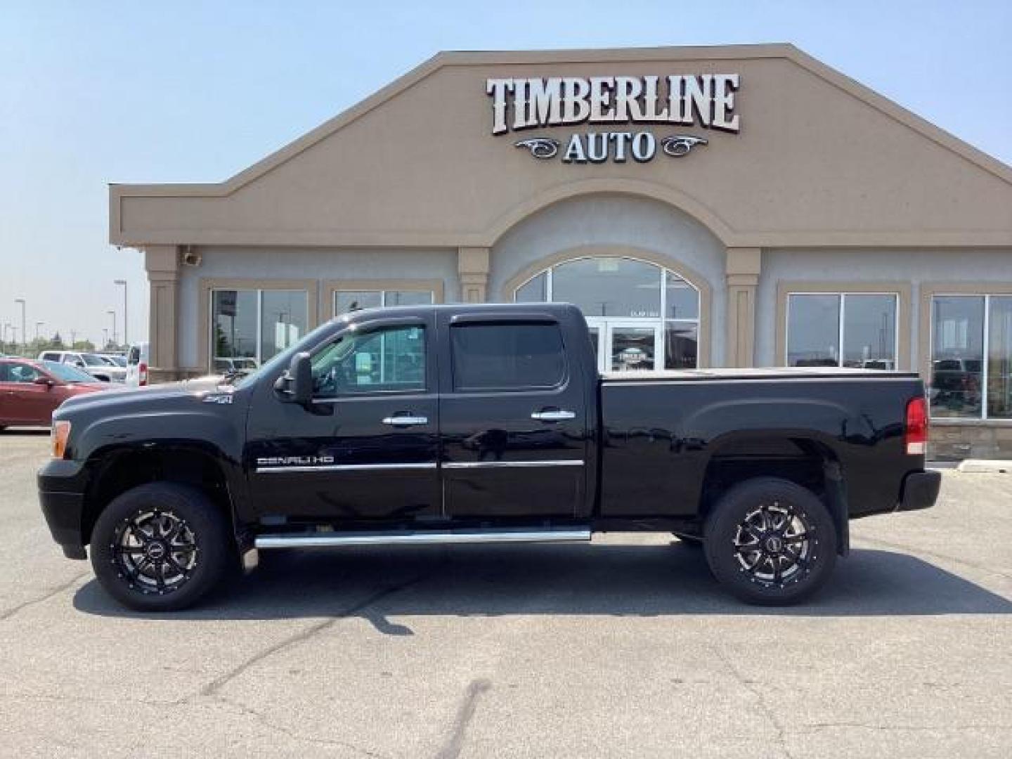 2012 Onyx Black GMC Sierra 2500HD Denali Crew Cab 4WD (1GT125E80CF) with an 6.6L V8 OHV 32V TURBO DIESEL engine, 6-Speed Automatic transmission, located at 1235 N Woodruff Ave., Idaho Falls, 83401, (208) 523-1053, 43.507172, -112.000488 - Photo#2