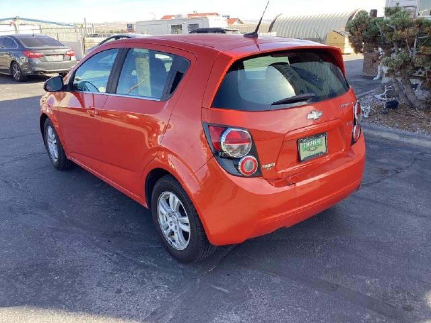 2012 Inferno Orange Metallic /Jet Blk/ Dark Titanium Cloth Interior Chevrolet Sonic 1LT 5-Door (1G1JD6SB5C4) with an 1.4L L4 DOHC 24V TURBO engine, 5-Speed Manual transmission, located at 1235 N Woodruff Ave., Idaho Falls, 83401, (208) 523-1053, 43.507172, -112.000488 - Get ready to enjoy a spirited drive with this 2012 Chevrolet Sonic Hatchback 1LT! Equipped with a peppy 1.4L turbocharged engine, this compact hatchback delivers impressive fuel efficiency without sacrificing performance. Perfect for urban commuting or weekend getaways, the Sonic combines style and - Photo#3