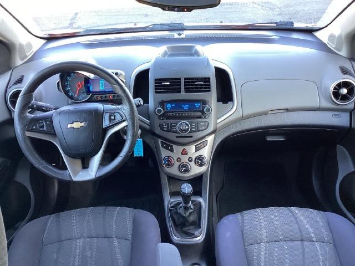 2012 Inferno Orange Metallic /Jet Blk/ Dark Titanium Cloth Interior Chevrolet Sonic 1LT 5-Door (1G1JD6SB5C4) with an 1.4L L4 DOHC 24V TURBO engine, 5-Speed Manual transmission, located at 1235 N Woodruff Ave., Idaho Falls, 83401, (208) 523-1053, 43.507172, -112.000488 - Get ready to enjoy a spirited drive with this 2012 Chevrolet Sonic Hatchback 1LT! Equipped with a peppy 1.4L turbocharged engine, this compact hatchback delivers impressive fuel efficiency without sacrificing performance. Perfect for urban commuting or weekend getaways, the Sonic combines style and - Photo#9