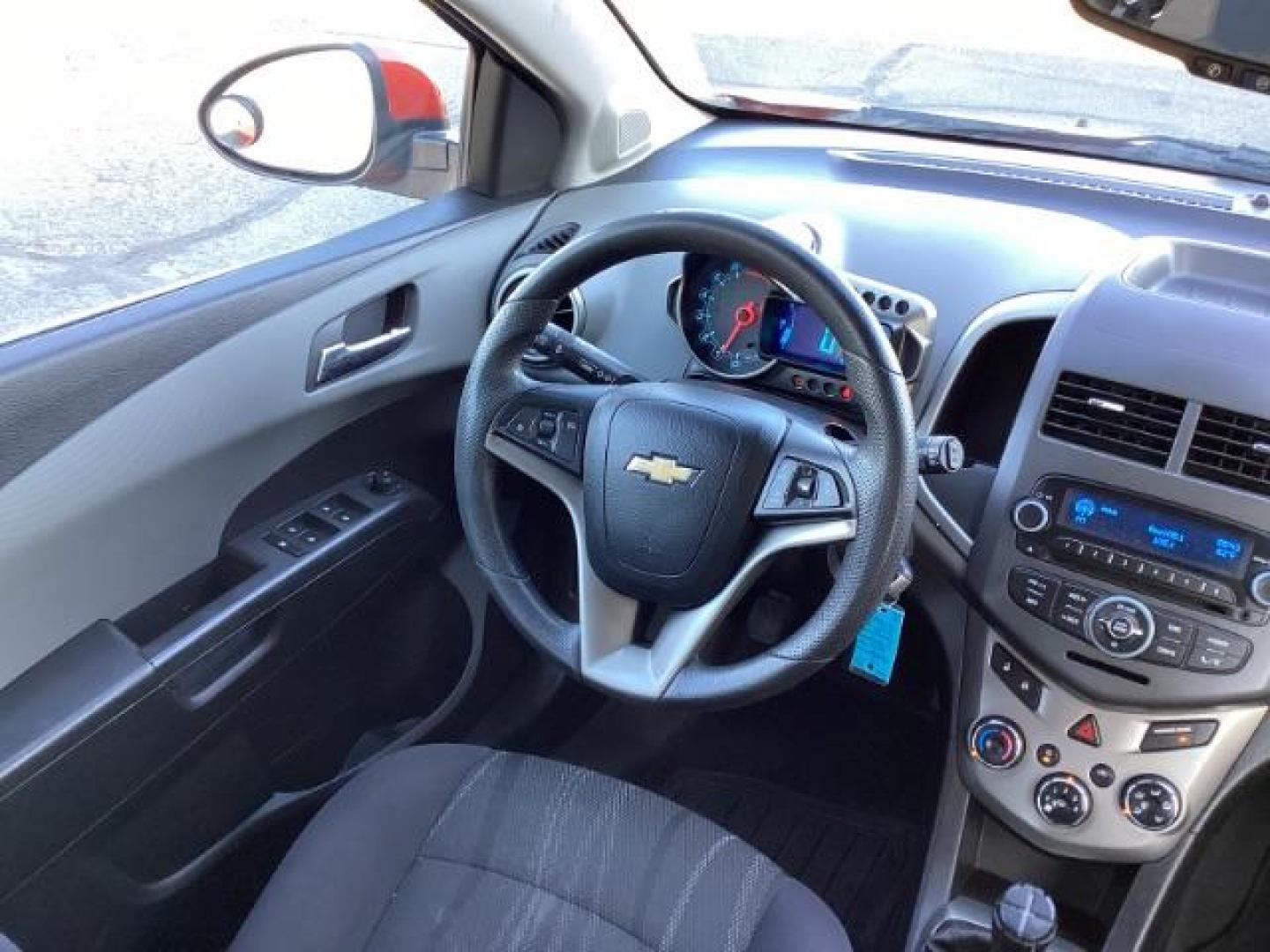 2012 Inferno Orange Metallic /Jet Blk/ Dark Titanium Cloth Interior Chevrolet Sonic 1LT 5-Door (1G1JD6SB5C4) with an 1.4L L4 DOHC 24V TURBO engine, 5-Speed Manual transmission, located at 1235 N Woodruff Ave., Idaho Falls, 83401, (208) 523-1053, 43.507172, -112.000488 - Get ready to enjoy a spirited drive with this 2012 Chevrolet Sonic Hatchback 1LT! Equipped with a peppy 1.4L turbocharged engine, this compact hatchback delivers impressive fuel efficiency without sacrificing performance. Perfect for urban commuting or weekend getaways, the Sonic combines style and - Photo#10