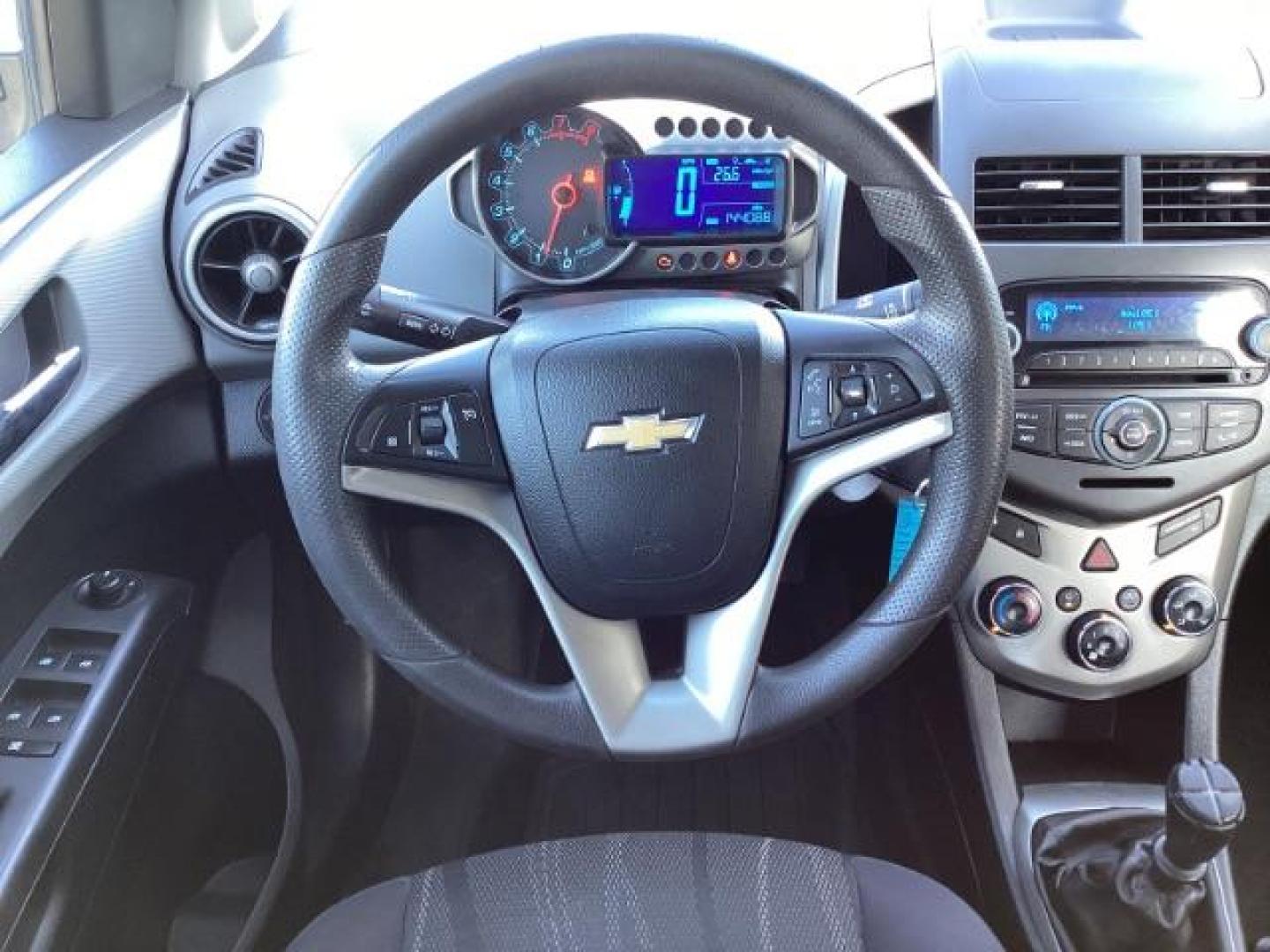 2012 Inferno Orange Metallic /Jet Blk/ Dark Titanium Cloth Interior Chevrolet Sonic 1LT 5-Door (1G1JD6SB5C4) with an 1.4L L4 DOHC 24V TURBO engine, 5-Speed Manual transmission, located at 1235 N Woodruff Ave., Idaho Falls, 83401, (208) 523-1053, 43.507172, -112.000488 - Get ready to enjoy a spirited drive with this 2012 Chevrolet Sonic Hatchback 1LT! Equipped with a peppy 1.4L turbocharged engine, this compact hatchback delivers impressive fuel efficiency without sacrificing performance. Perfect for urban commuting or weekend getaways, the Sonic combines style and - Photo#14