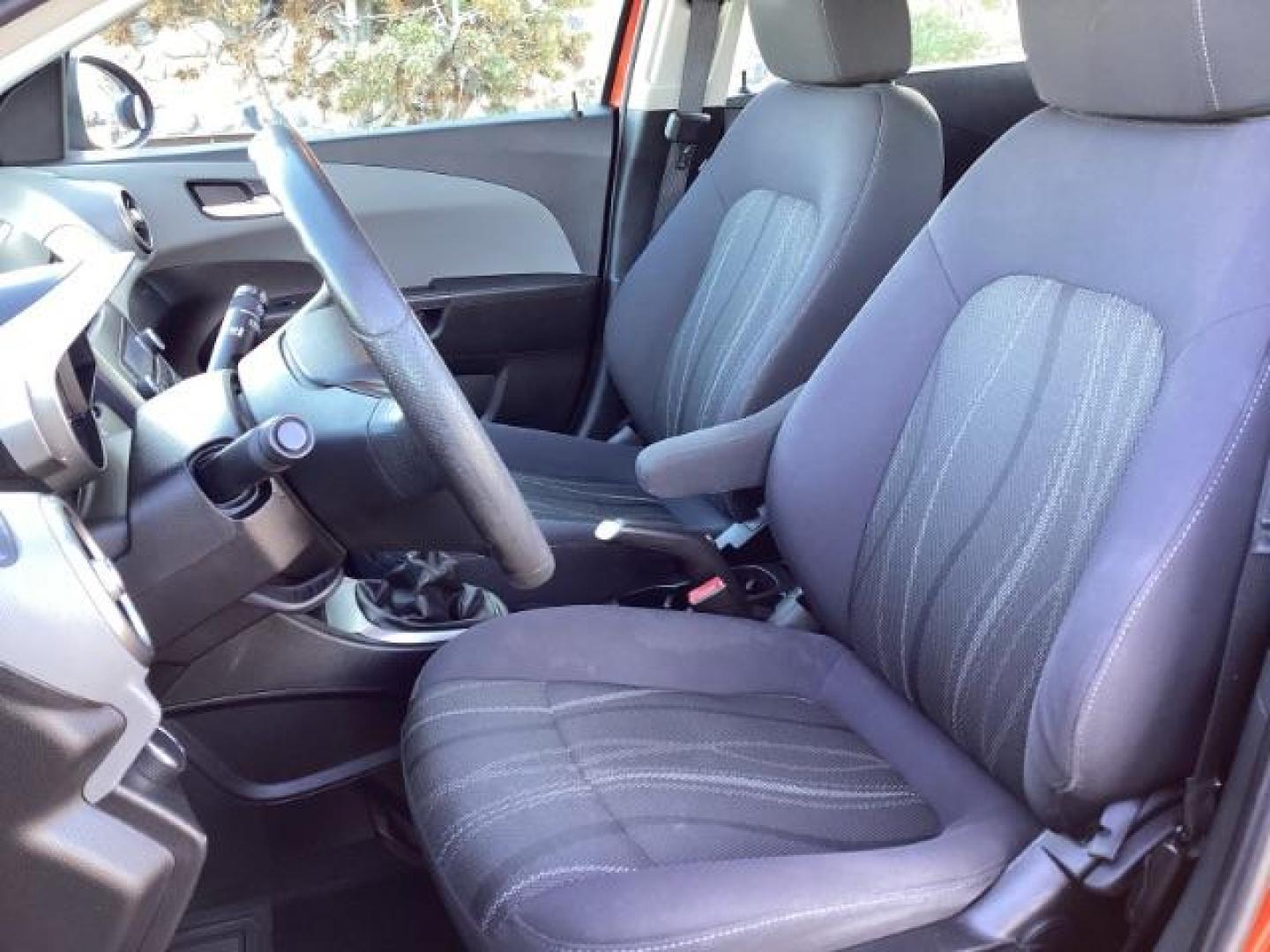 2012 Inferno Orange Metallic /Jet Blk/ Dark Titanium Cloth Interior Chevrolet Sonic 1LT 5-Door (1G1JD6SB5C4) with an 1.4L L4 DOHC 24V TURBO engine, 5-Speed Manual transmission, located at 1235 N Woodruff Ave., Idaho Falls, 83401, (208) 523-1053, 43.507172, -112.000488 - Get ready to enjoy a spirited drive with this 2012 Chevrolet Sonic Hatchback 1LT! Equipped with a peppy 1.4L turbocharged engine, this compact hatchback delivers impressive fuel efficiency without sacrificing performance. Perfect for urban commuting or weekend getaways, the Sonic combines style and - Photo#15