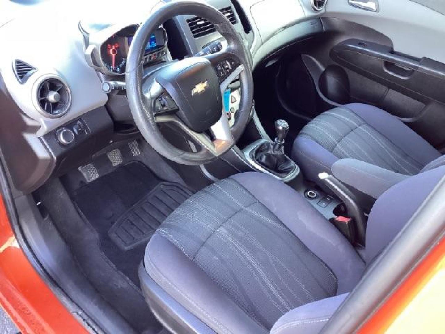 2012 Inferno Orange Metallic /Jet Blk/ Dark Titanium Cloth Interior Chevrolet Sonic 1LT 5-Door (1G1JD6SB5C4) with an 1.4L L4 DOHC 24V TURBO engine, 5-Speed Manual transmission, located at 1235 N Woodruff Ave., Idaho Falls, 83401, (208) 523-1053, 43.507172, -112.000488 - Get ready to enjoy a spirited drive with this 2012 Chevrolet Sonic Hatchback 1LT! Equipped with a peppy 1.4L turbocharged engine, this compact hatchback delivers impressive fuel efficiency without sacrificing performance. Perfect for urban commuting or weekend getaways, the Sonic combines style and - Photo#16