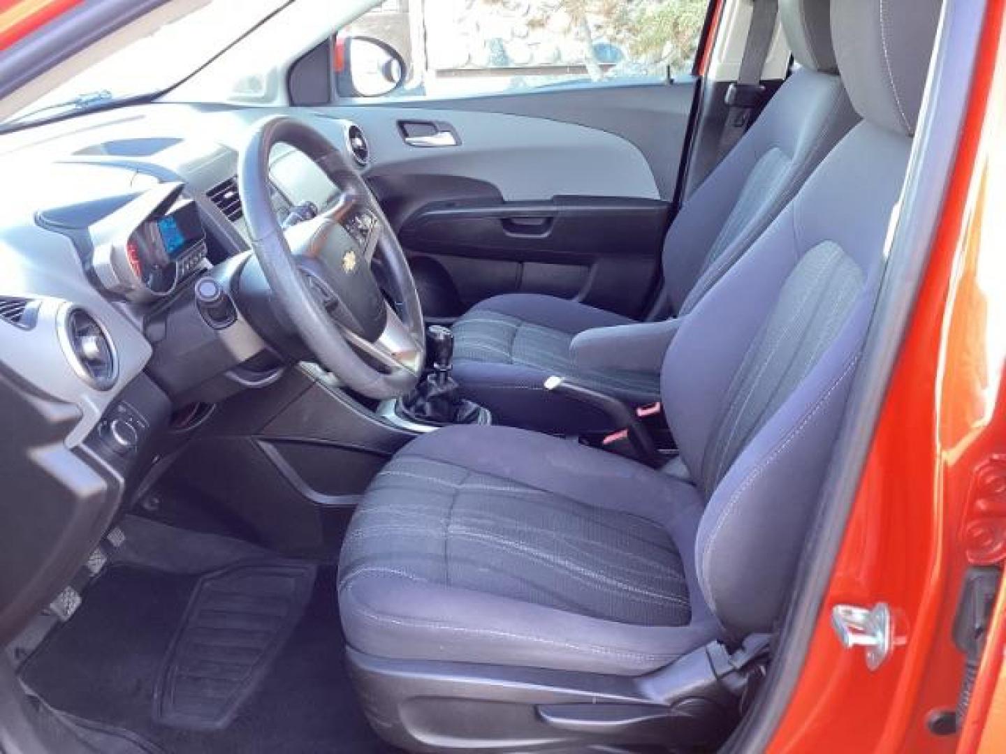 2012 Inferno Orange Metallic /Jet Blk/ Dark Titanium Cloth Interior Chevrolet Sonic 1LT 5-Door (1G1JD6SB5C4) with an 1.4L L4 DOHC 24V TURBO engine, 5-Speed Manual transmission, located at 1235 N Woodruff Ave., Idaho Falls, 83401, (208) 523-1053, 43.507172, -112.000488 - Get ready to enjoy a spirited drive with this 2012 Chevrolet Sonic Hatchback 1LT! Equipped with a peppy 1.4L turbocharged engine, this compact hatchback delivers impressive fuel efficiency without sacrificing performance. Perfect for urban commuting or weekend getaways, the Sonic combines style and - Photo#17