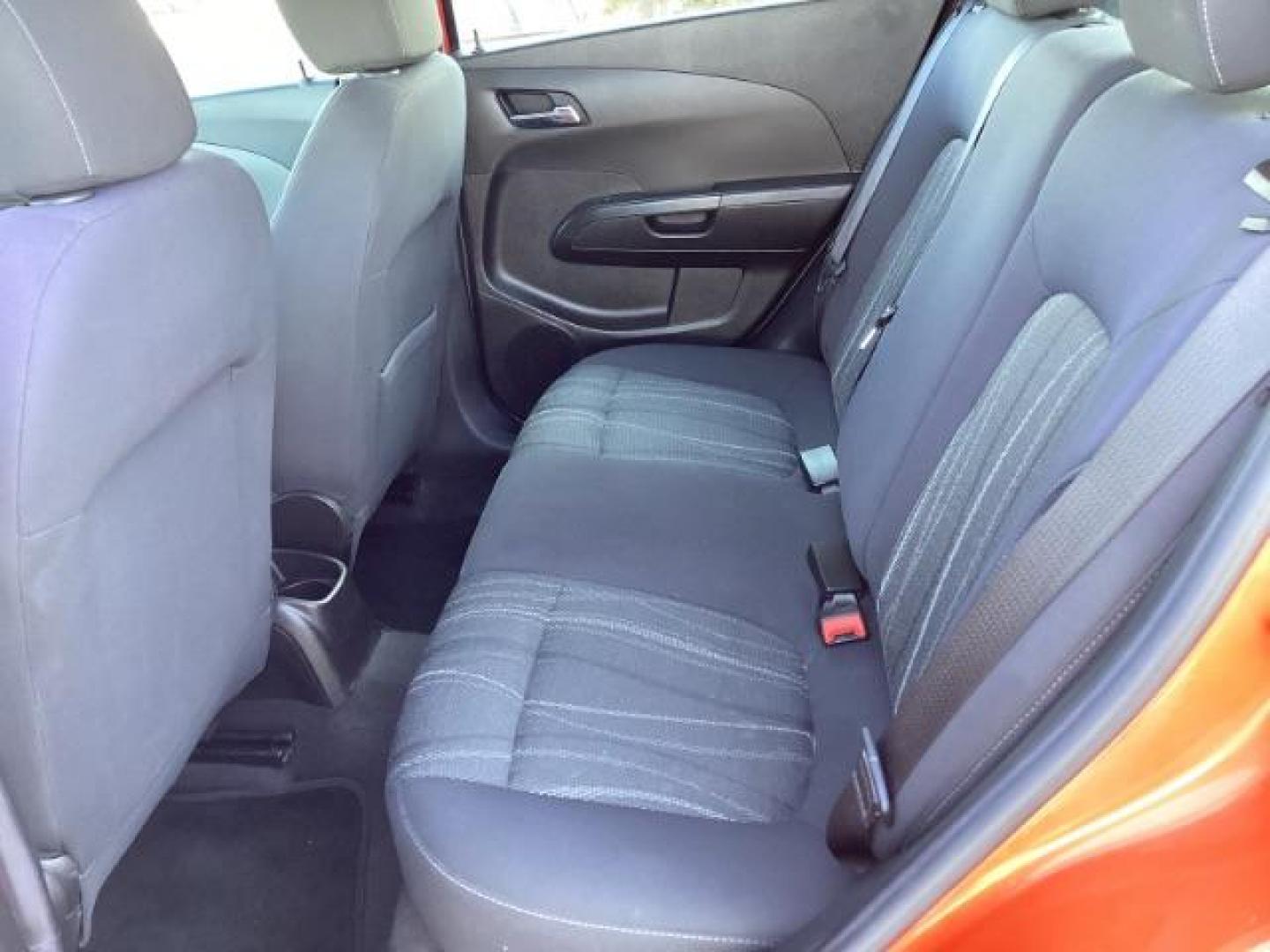 2012 Inferno Orange Metallic /Jet Blk/ Dark Titanium Cloth Interior Chevrolet Sonic 1LT 5-Door (1G1JD6SB5C4) with an 1.4L L4 DOHC 24V TURBO engine, 5-Speed Manual transmission, located at 1235 N Woodruff Ave., Idaho Falls, 83401, (208) 523-1053, 43.507172, -112.000488 - Get ready to enjoy a spirited drive with this 2012 Chevrolet Sonic Hatchback 1LT! Equipped with a peppy 1.4L turbocharged engine, this compact hatchback delivers impressive fuel efficiency without sacrificing performance. Perfect for urban commuting or weekend getaways, the Sonic combines style and - Photo#18