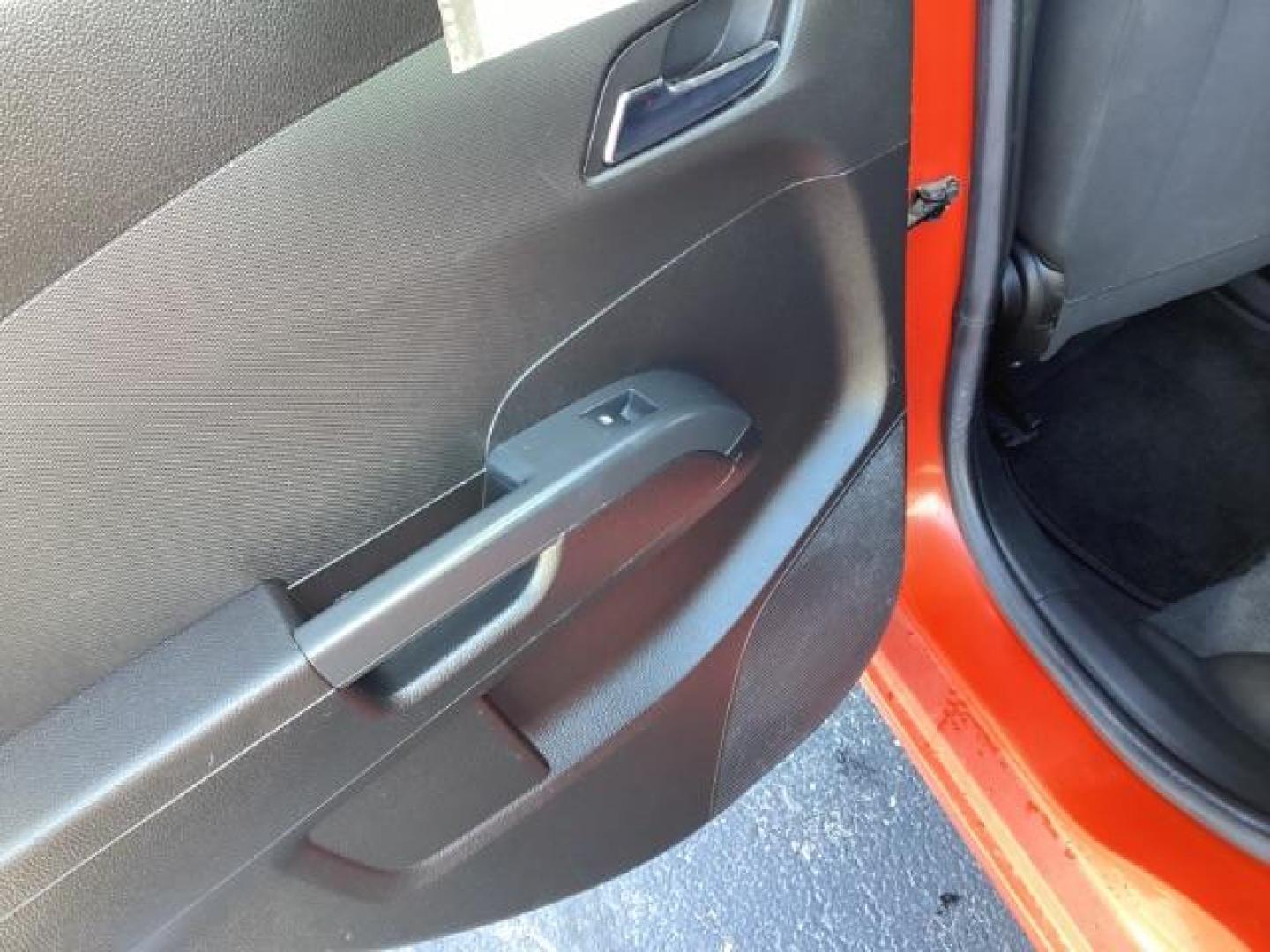 2012 Inferno Orange Metallic /Jet Blk/ Dark Titanium Cloth Interior Chevrolet Sonic 1LT 5-Door (1G1JD6SB5C4) with an 1.4L L4 DOHC 24V TURBO engine, 5-Speed Manual transmission, located at 1235 N Woodruff Ave., Idaho Falls, 83401, (208) 523-1053, 43.507172, -112.000488 - Get ready to enjoy a spirited drive with this 2012 Chevrolet Sonic Hatchback 1LT! Equipped with a peppy 1.4L turbocharged engine, this compact hatchback delivers impressive fuel efficiency without sacrificing performance. Perfect for urban commuting or weekend getaways, the Sonic combines style and - Photo#19