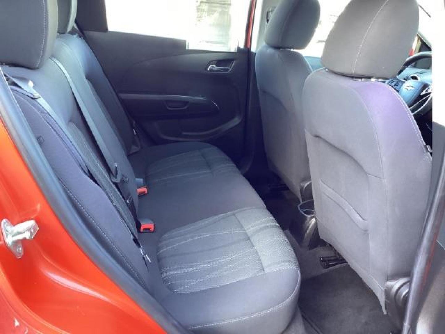 2012 Inferno Orange Metallic /Jet Blk/ Dark Titanium Cloth Interior Chevrolet Sonic 1LT 5-Door (1G1JD6SB5C4) with an 1.4L L4 DOHC 24V TURBO engine, 5-Speed Manual transmission, located at 1235 N Woodruff Ave., Idaho Falls, 83401, (208) 523-1053, 43.507172, -112.000488 - Get ready to enjoy a spirited drive with this 2012 Chevrolet Sonic Hatchback 1LT! Equipped with a peppy 1.4L turbocharged engine, this compact hatchback delivers impressive fuel efficiency without sacrificing performance. Perfect for urban commuting or weekend getaways, the Sonic combines style and - Photo#20