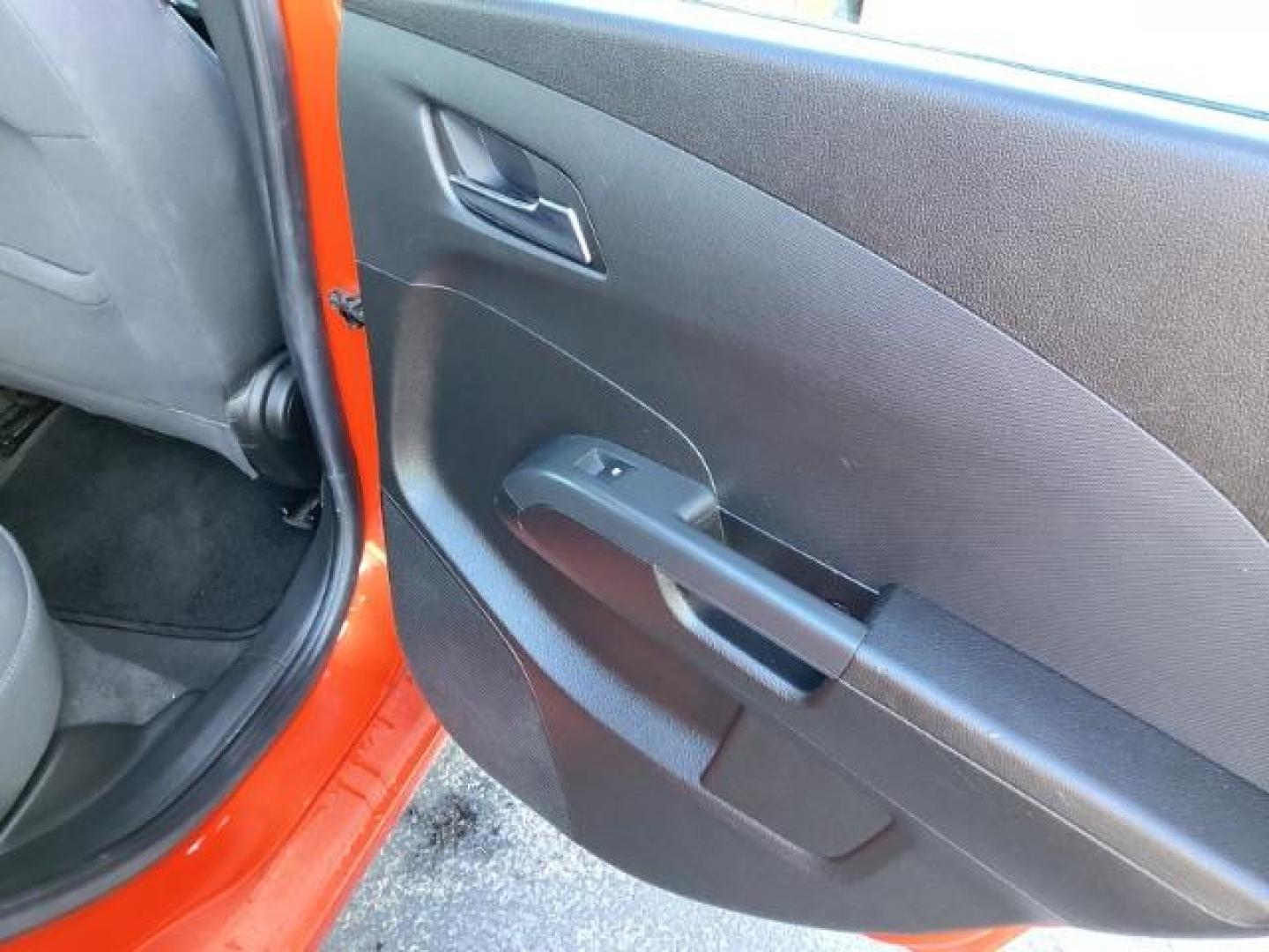 2012 Inferno Orange Metallic /Jet Blk/ Dark Titanium Cloth Interior Chevrolet Sonic 1LT 5-Door (1G1JD6SB5C4) with an 1.4L L4 DOHC 24V TURBO engine, 5-Speed Manual transmission, located at 1235 N Woodruff Ave., Idaho Falls, 83401, (208) 523-1053, 43.507172, -112.000488 - Get ready to enjoy a spirited drive with this 2012 Chevrolet Sonic Hatchback 1LT! Equipped with a peppy 1.4L turbocharged engine, this compact hatchback delivers impressive fuel efficiency without sacrificing performance. Perfect for urban commuting or weekend getaways, the Sonic combines style and - Photo#21