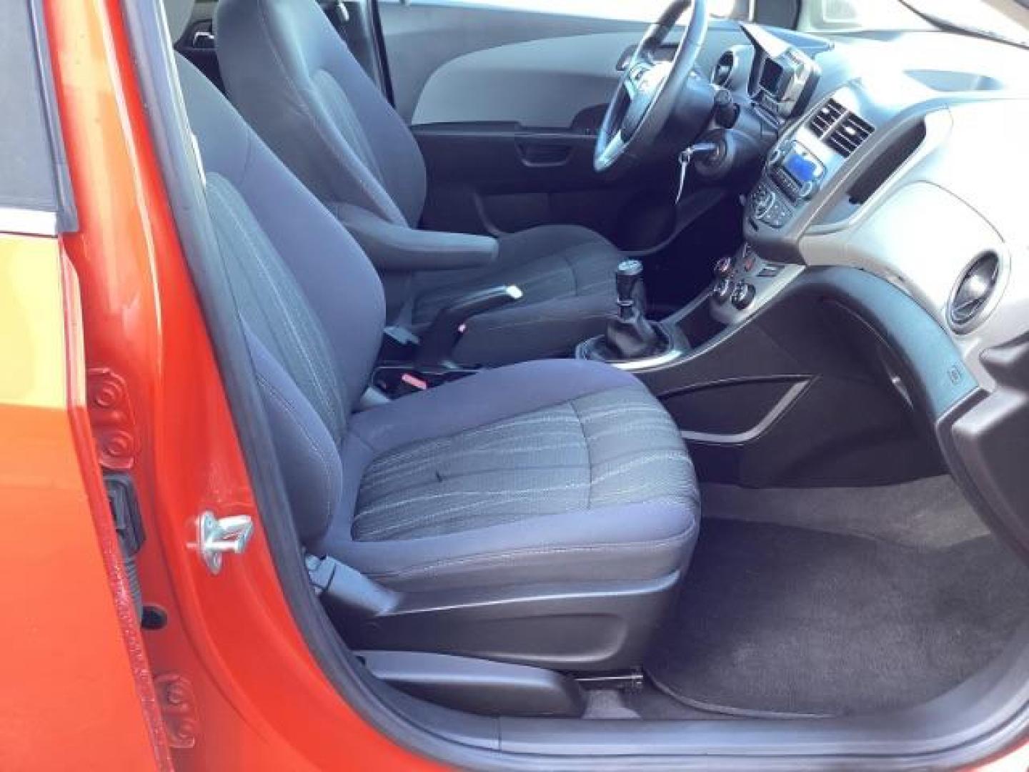2012 Inferno Orange Metallic /Jet Blk/ Dark Titanium Cloth Interior Chevrolet Sonic 1LT 5-Door (1G1JD6SB5C4) with an 1.4L L4 DOHC 24V TURBO engine, 5-Speed Manual transmission, located at 1235 N Woodruff Ave., Idaho Falls, 83401, (208) 523-1053, 43.507172, -112.000488 - Get ready to enjoy a spirited drive with this 2012 Chevrolet Sonic Hatchback 1LT! Equipped with a peppy 1.4L turbocharged engine, this compact hatchback delivers impressive fuel efficiency without sacrificing performance. Perfect for urban commuting or weekend getaways, the Sonic combines style and - Photo#22
